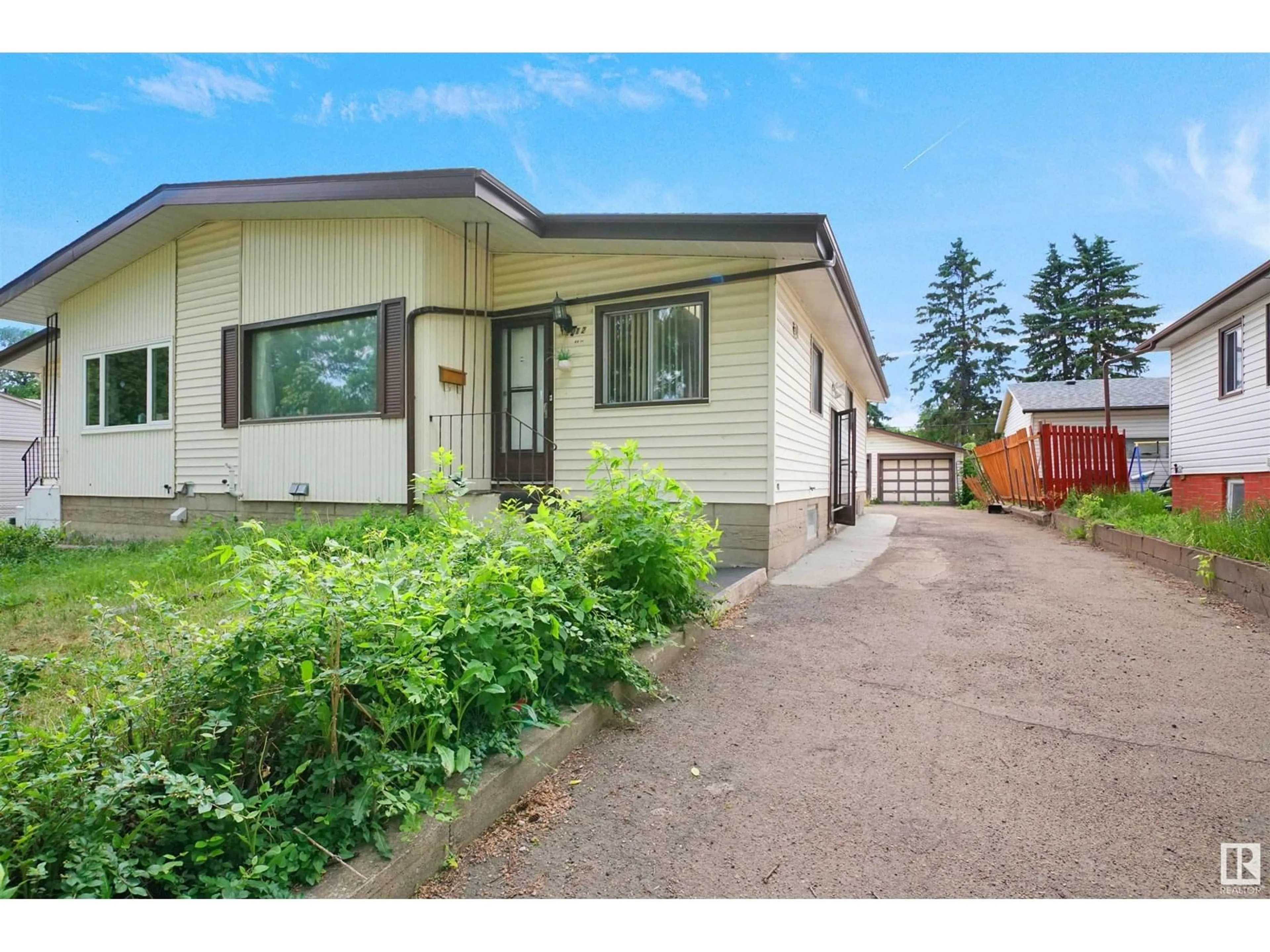 Home with vinyl exterior material, street for 12012 49 ST, Edmonton Alberta T5W3A4