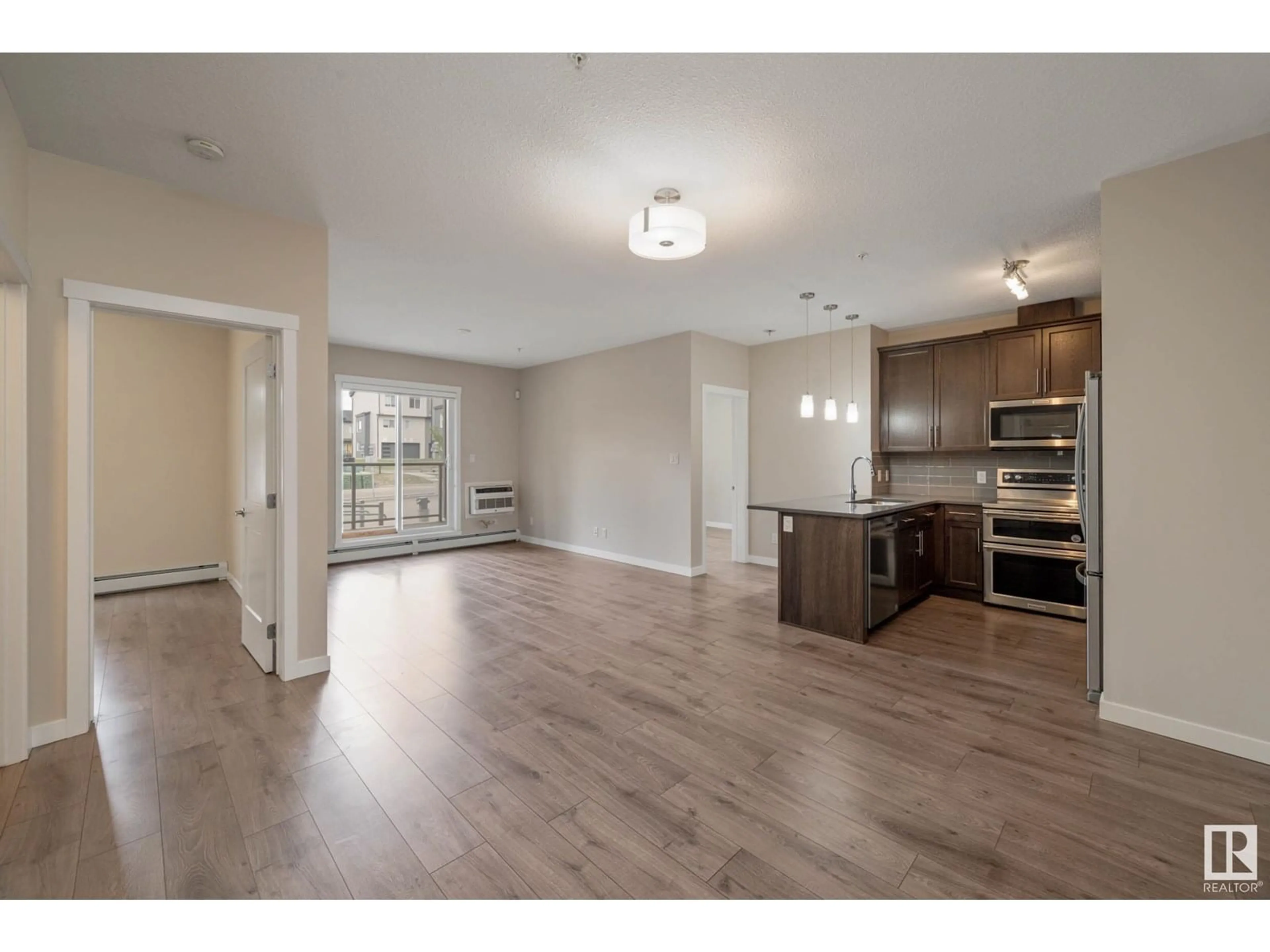 Open concept kitchen, wood/laminate floor for #116 - 812 WELSH DR, Edmonton Alberta T6X1Y7