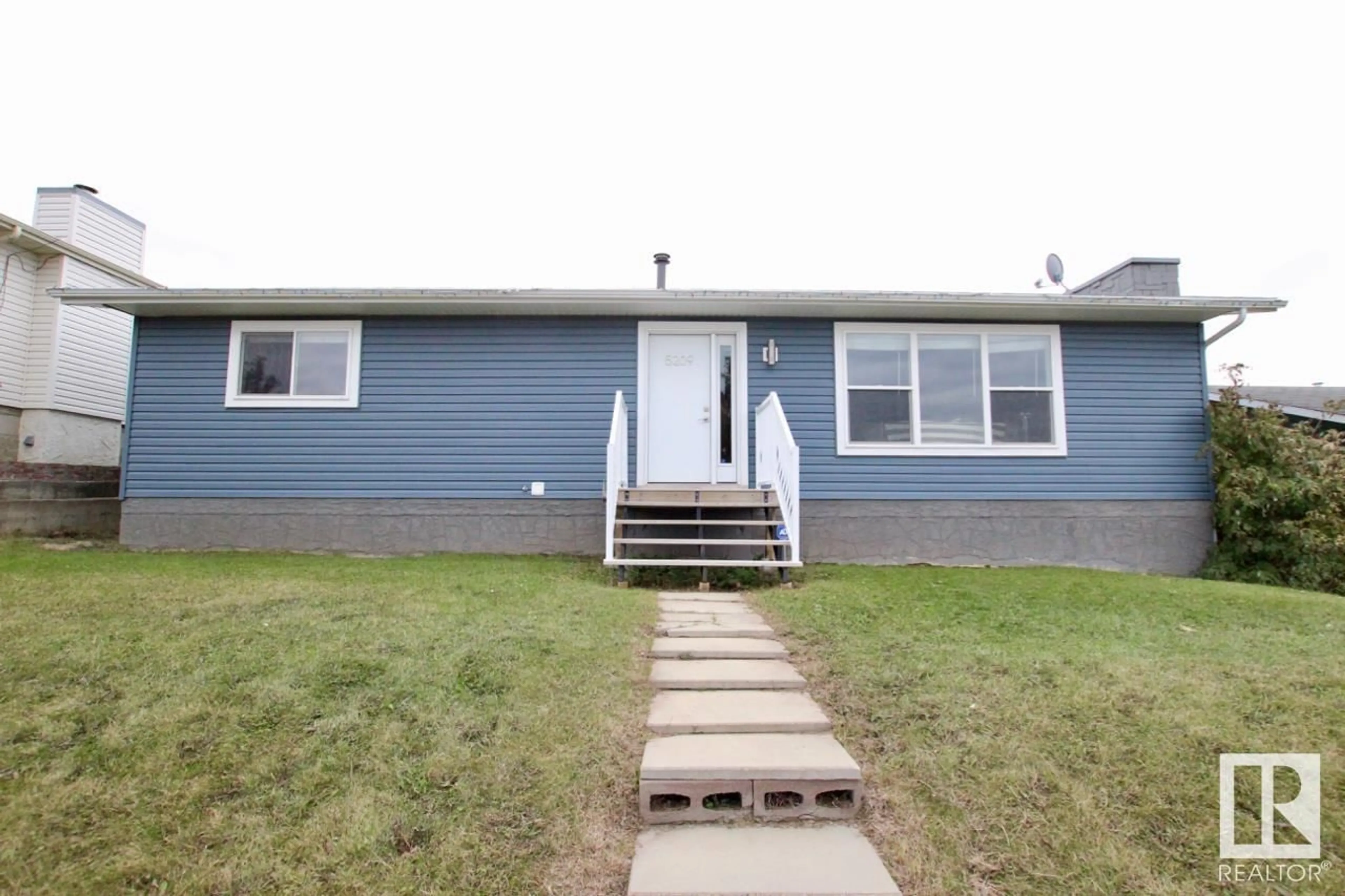 Home with vinyl exterior material, street for 5209 FIRST AV, Boyle Alberta T0A0M0
