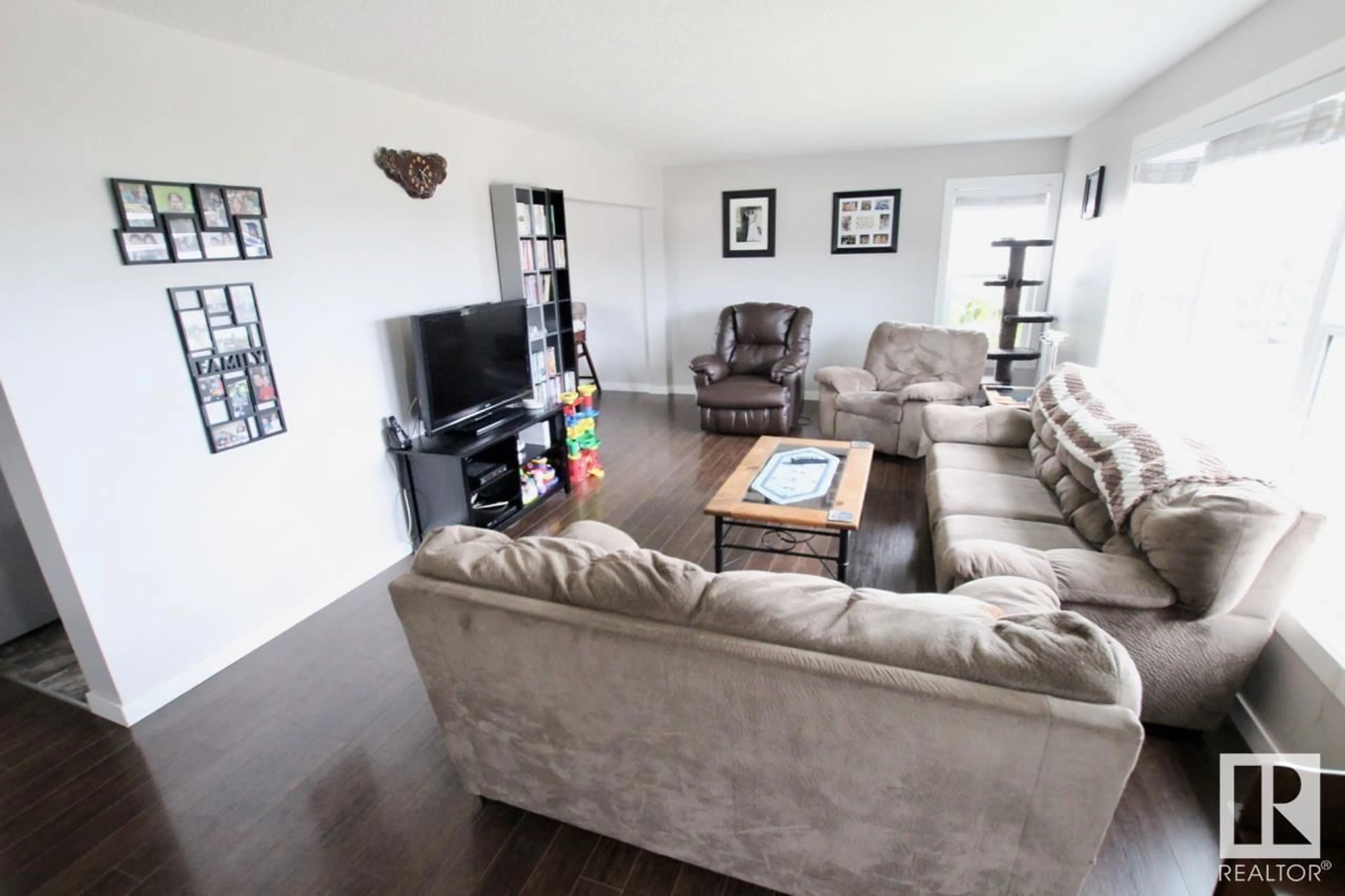 Living room with furniture, wood/laminate floor for 5209 FIRST AV, Boyle Alberta T0A0M0