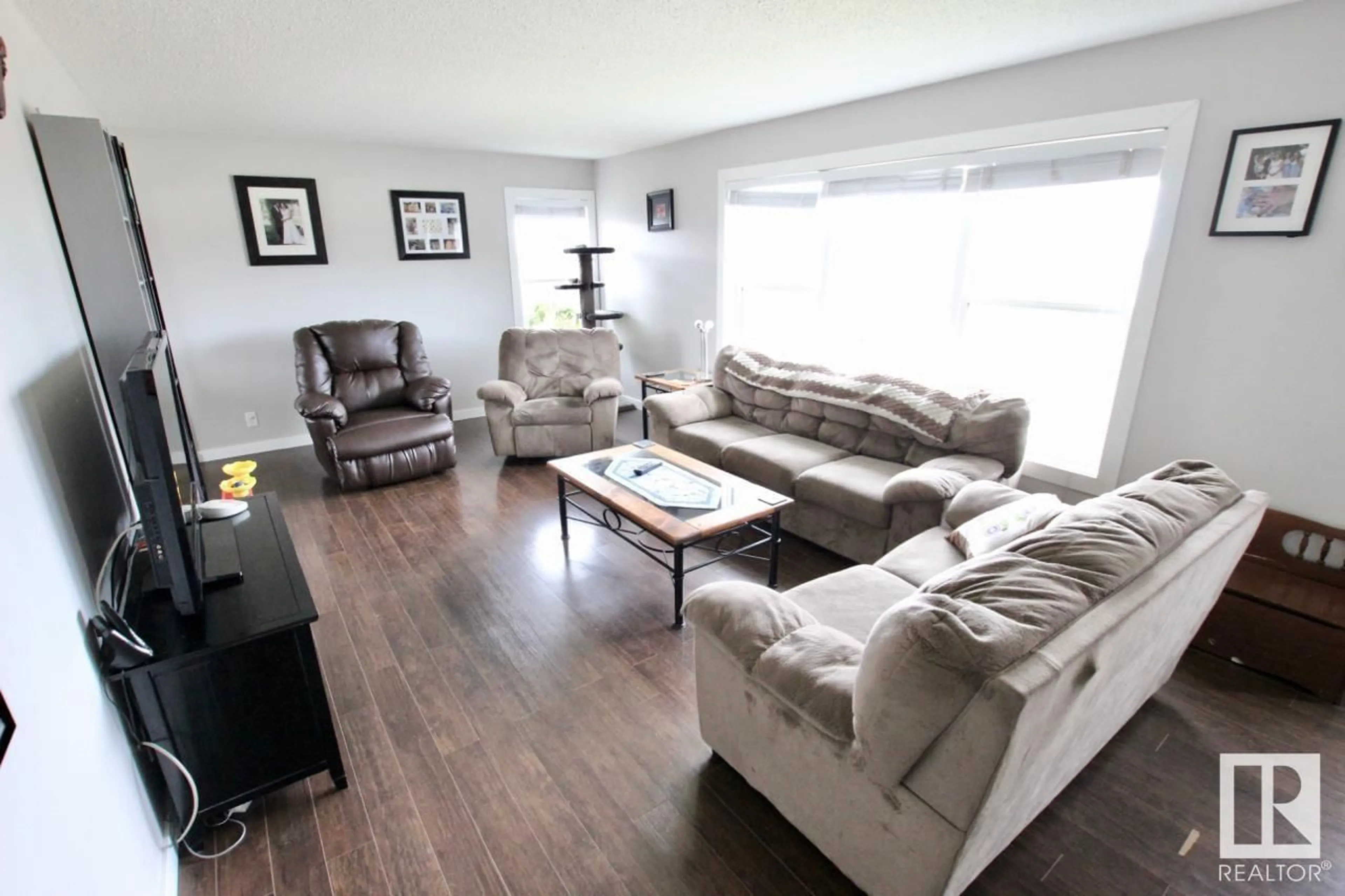 Living room with furniture, wood/laminate floor for 5209 FIRST AV, Boyle Alberta T0A0M0