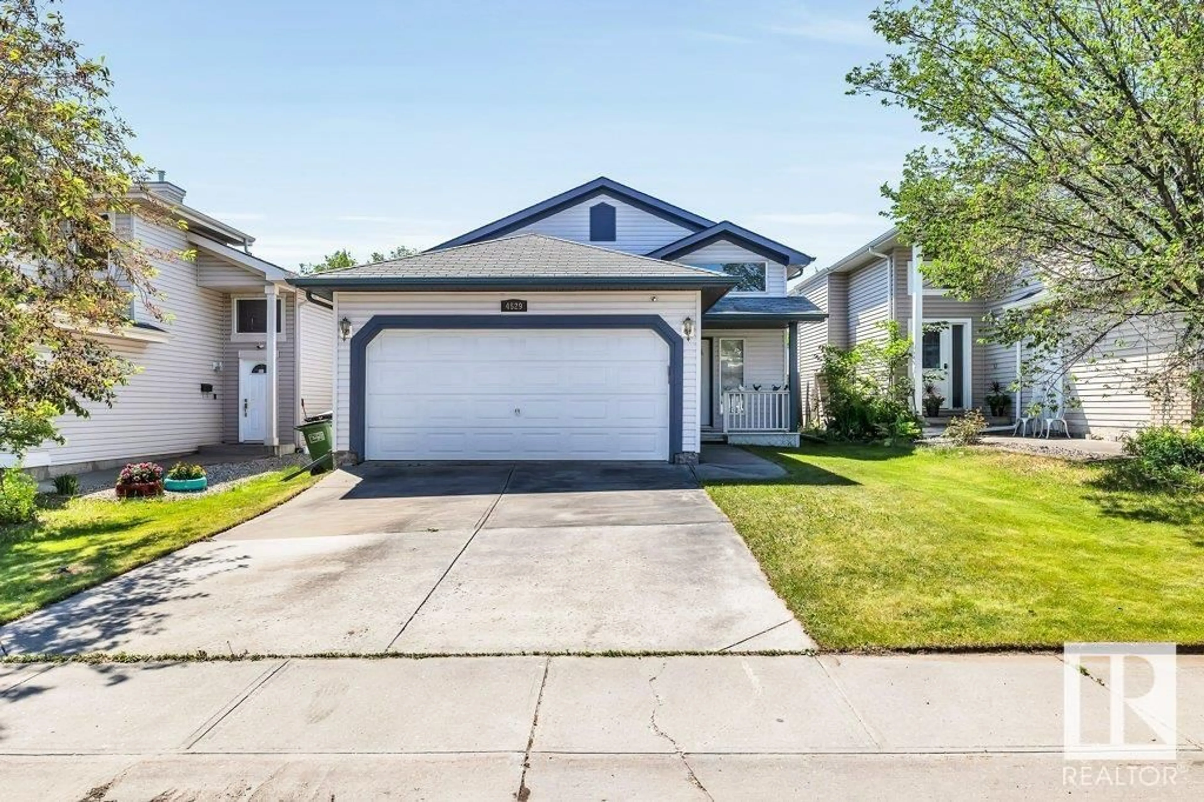Home with vinyl exterior material, street for 4529 154 AV, Edmonton Alberta T5Y3H3