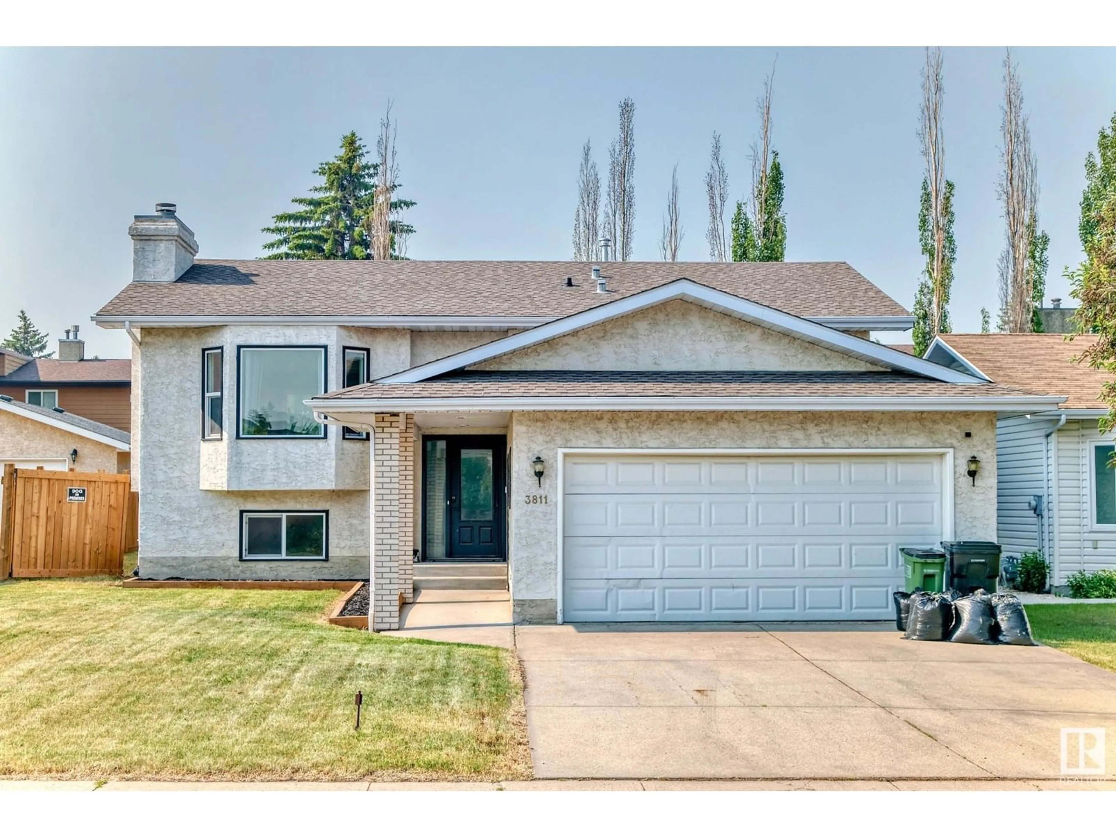 Home with vinyl exterior material, street for 3811 21 AV, Edmonton Alberta T6L4T4
