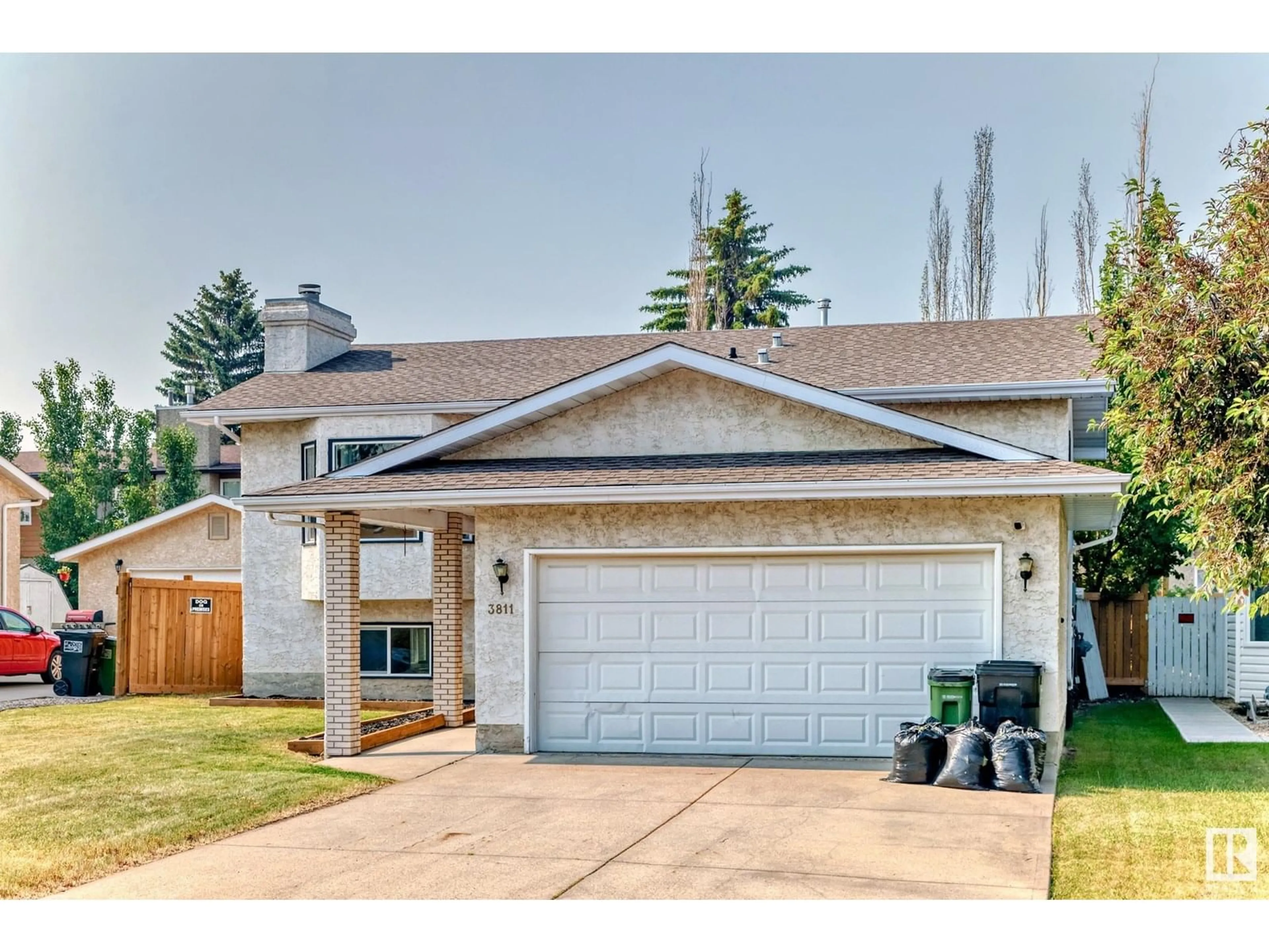 Home with vinyl exterior material, street for 3811 21 AV, Edmonton Alberta T6L4T4
