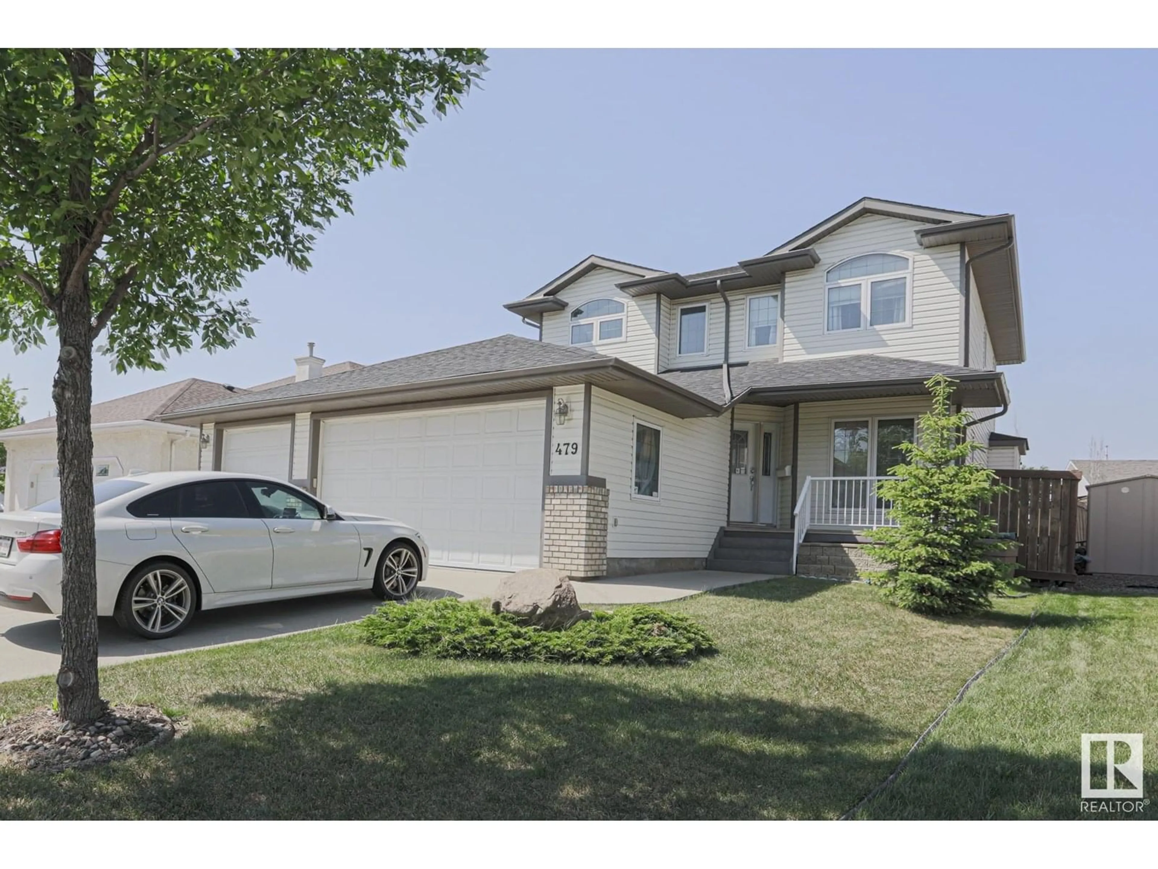 Home with vinyl exterior material, street for 479 OZERNA RD, Edmonton Alberta T5Z3P8