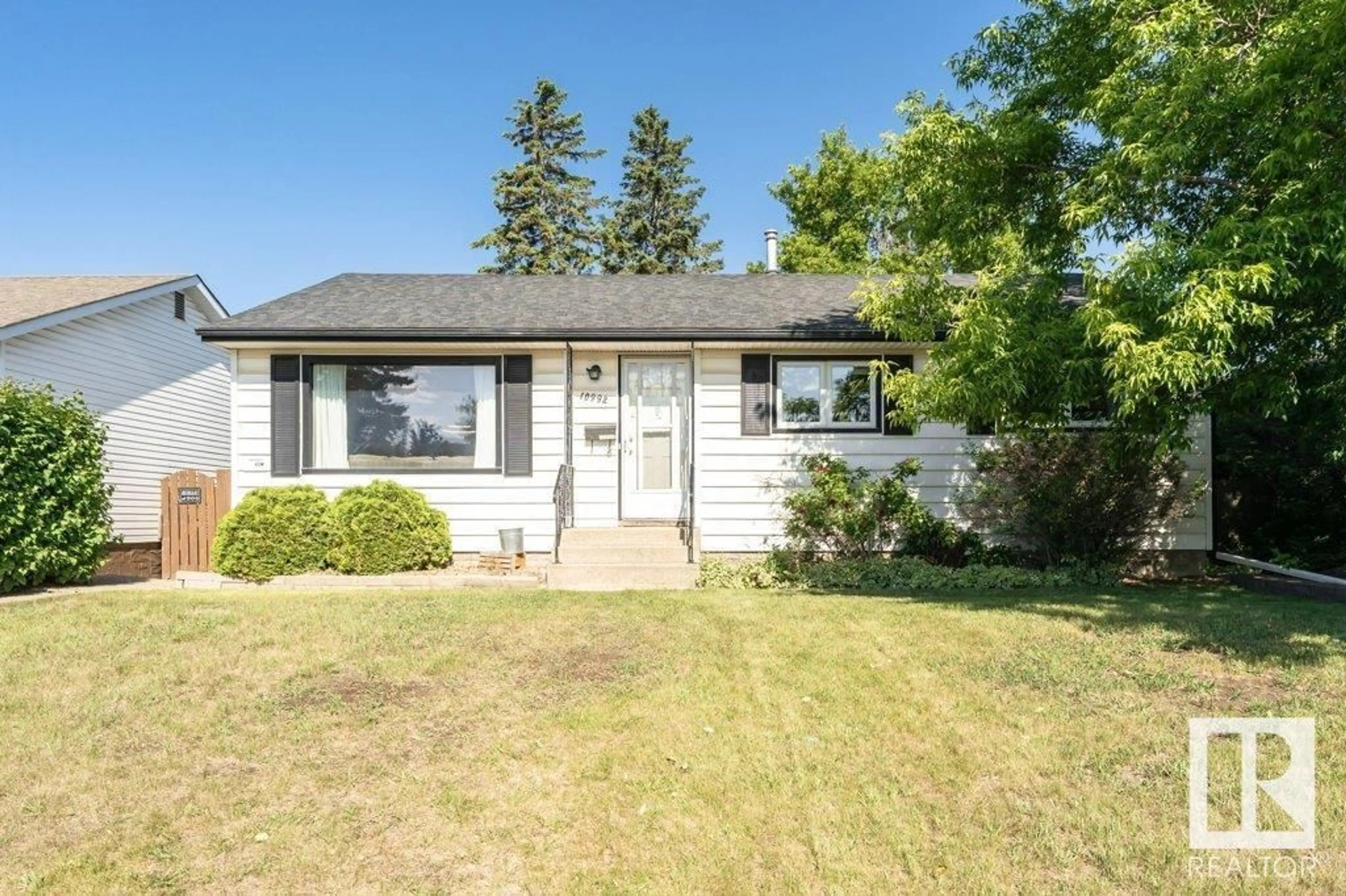 Home with vinyl exterior material, street for 10992 165 ST NW, Edmonton Alberta T5P3T7