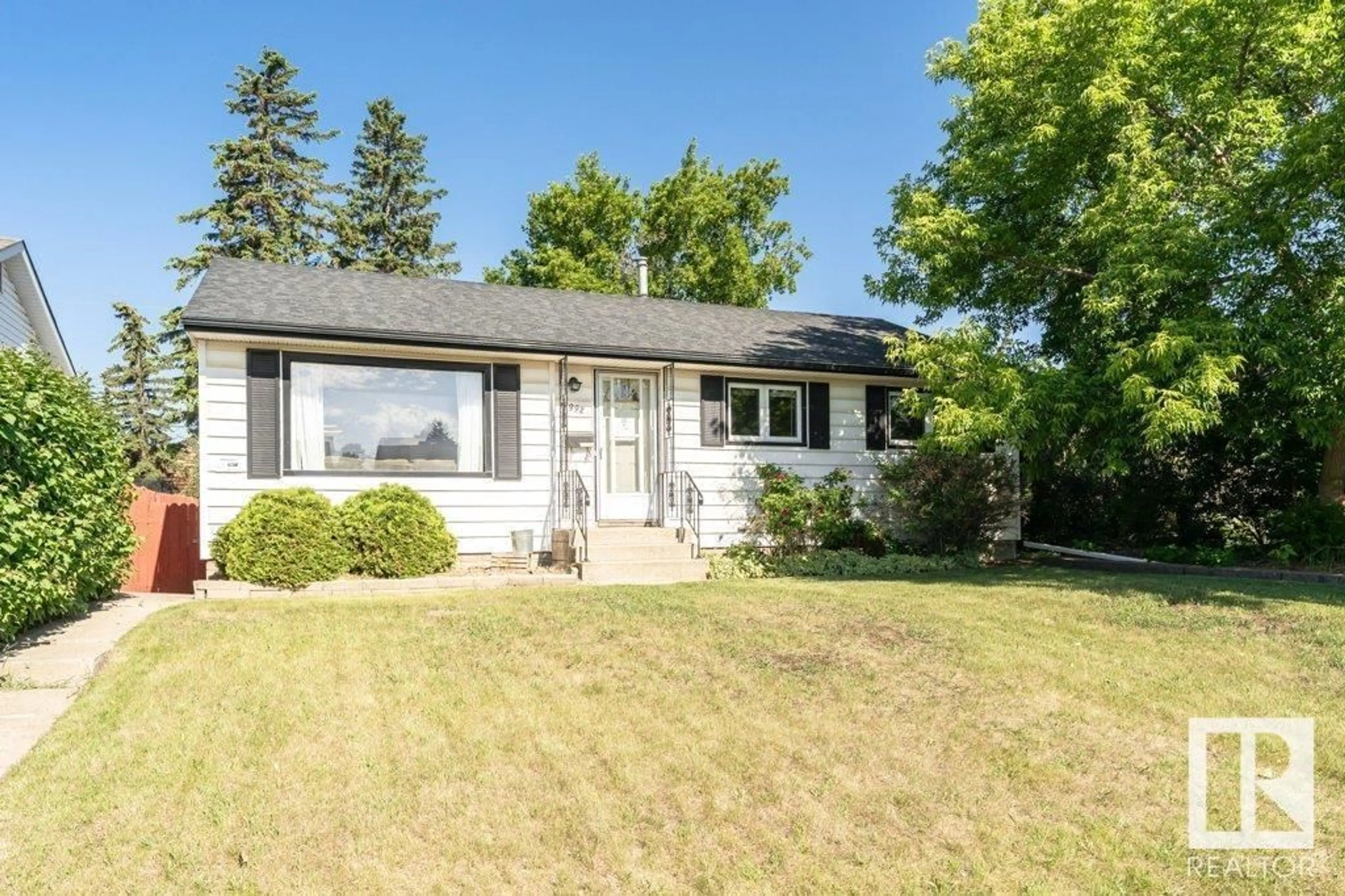 Home with vinyl exterior material, street for 10992 165 ST NW, Edmonton Alberta T5P3T7