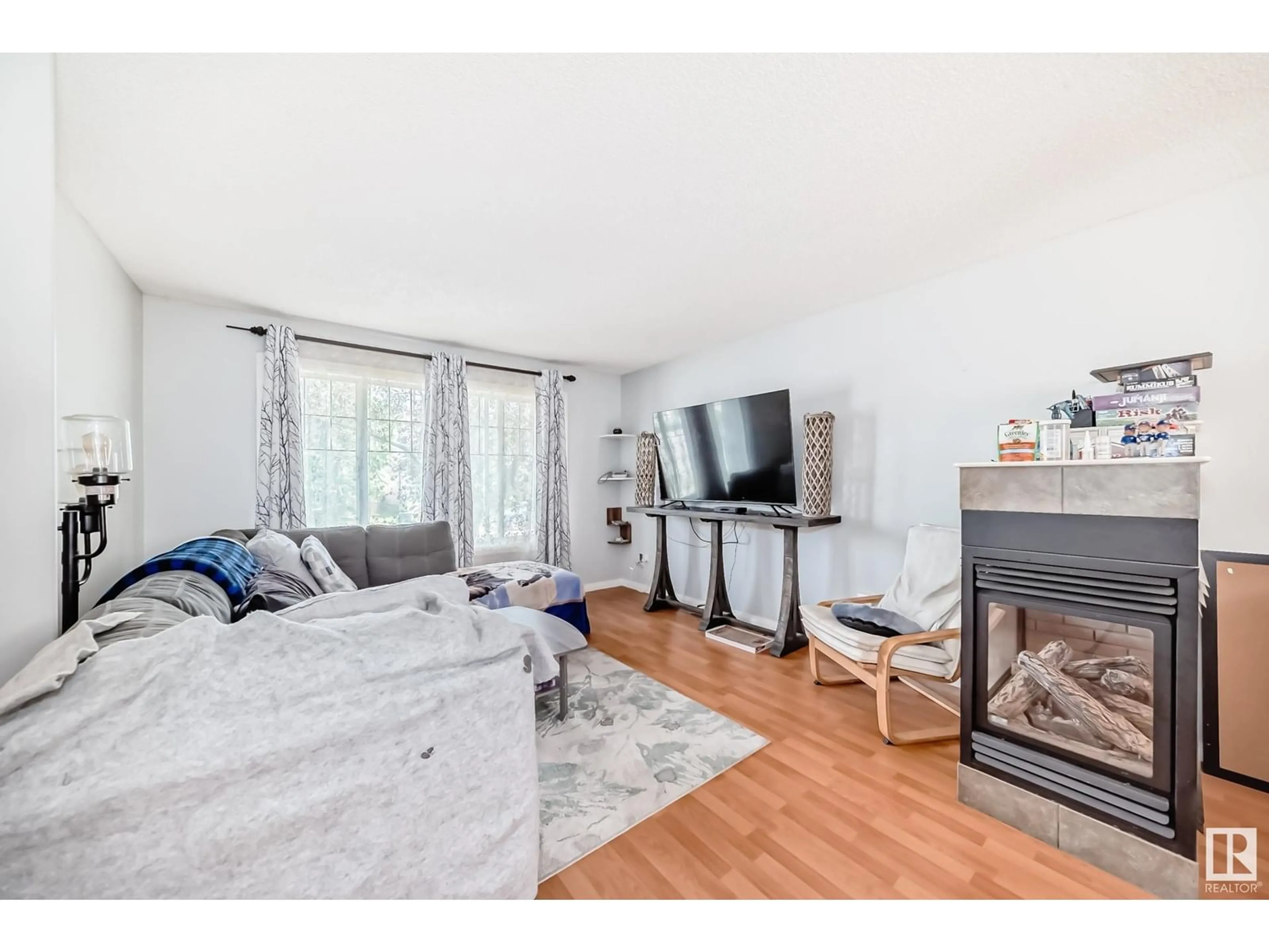Living room with furniture, wood/laminate floor for 206 85 ST, Edmonton Alberta T6X1H5