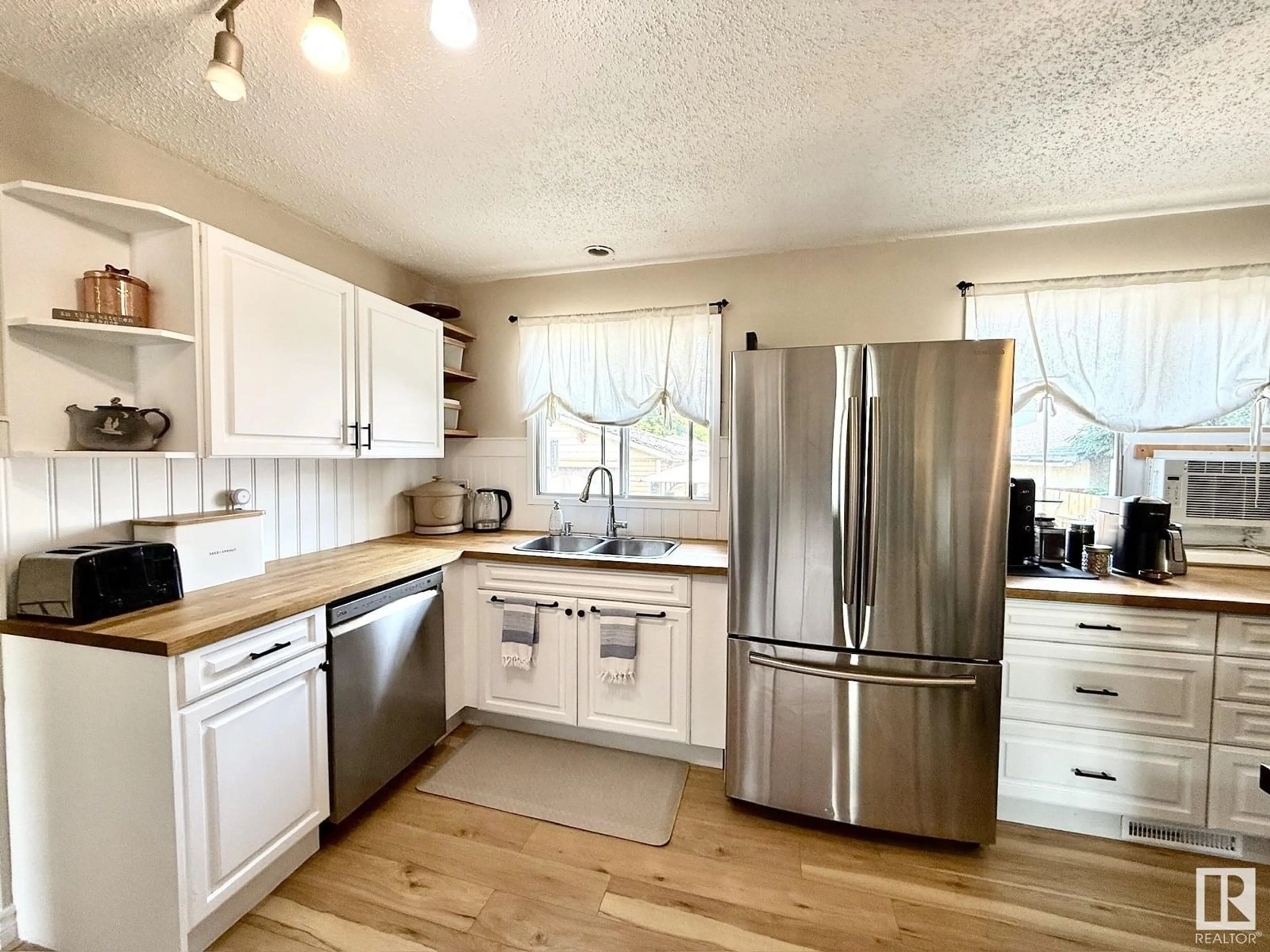 Open concept kitchen, wood/laminate floor for 4920 48 AV, Bon Accord Alberta T0A0K0