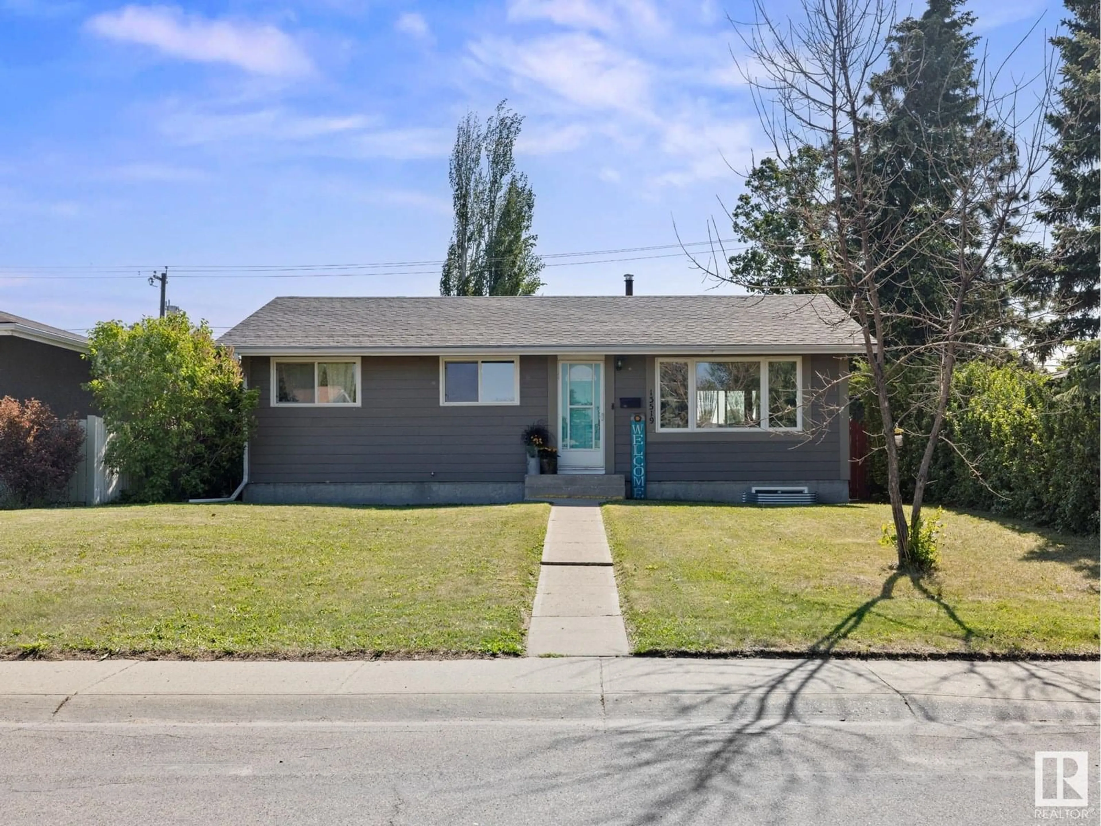 Home with vinyl exterior material, street for 13519 124 ST, Edmonton Alberta T5L0R7