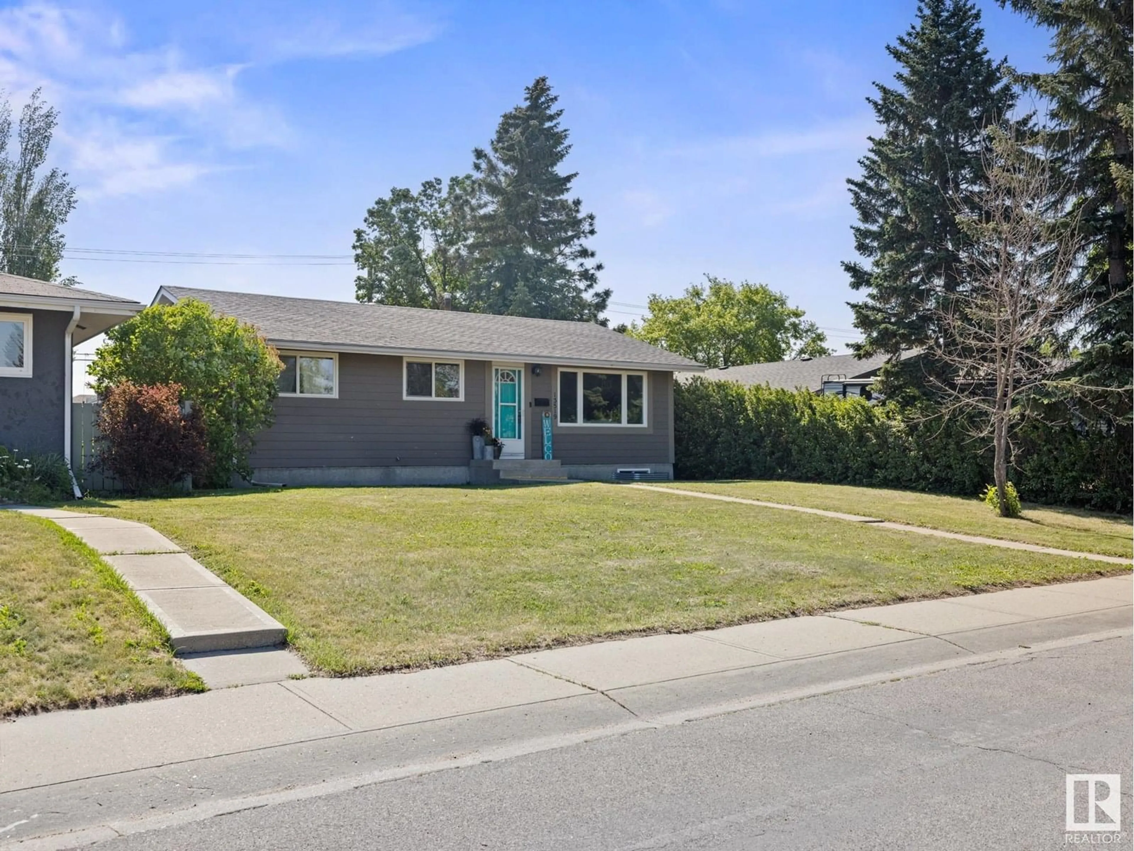 Home with vinyl exterior material, street for 13519 124 ST, Edmonton Alberta T5L0R7