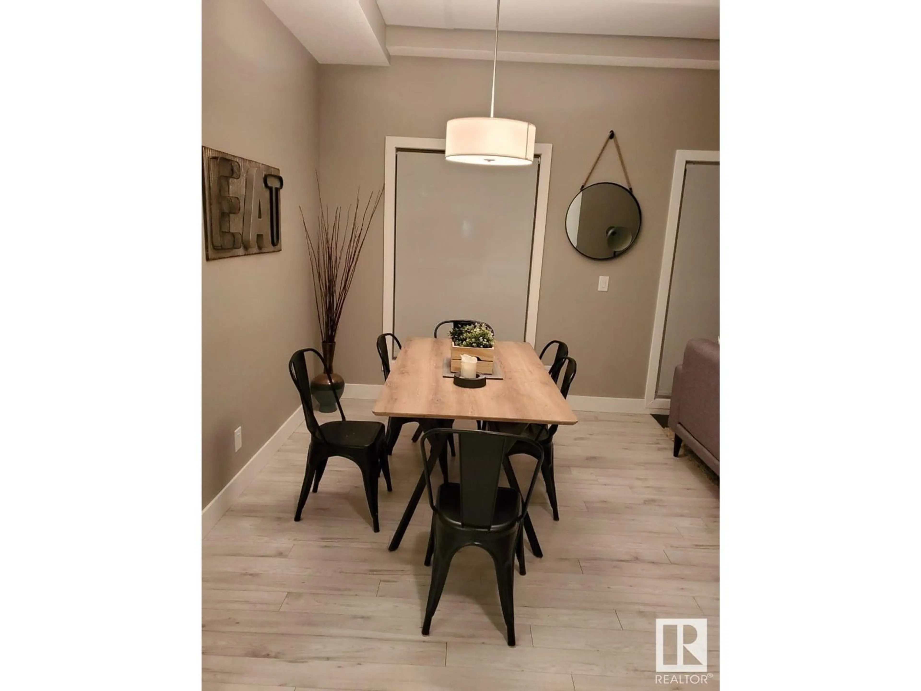 Dining room, wood/laminate floor for #103 - 10006 83 AV, Edmonton Alberta T6E2C2