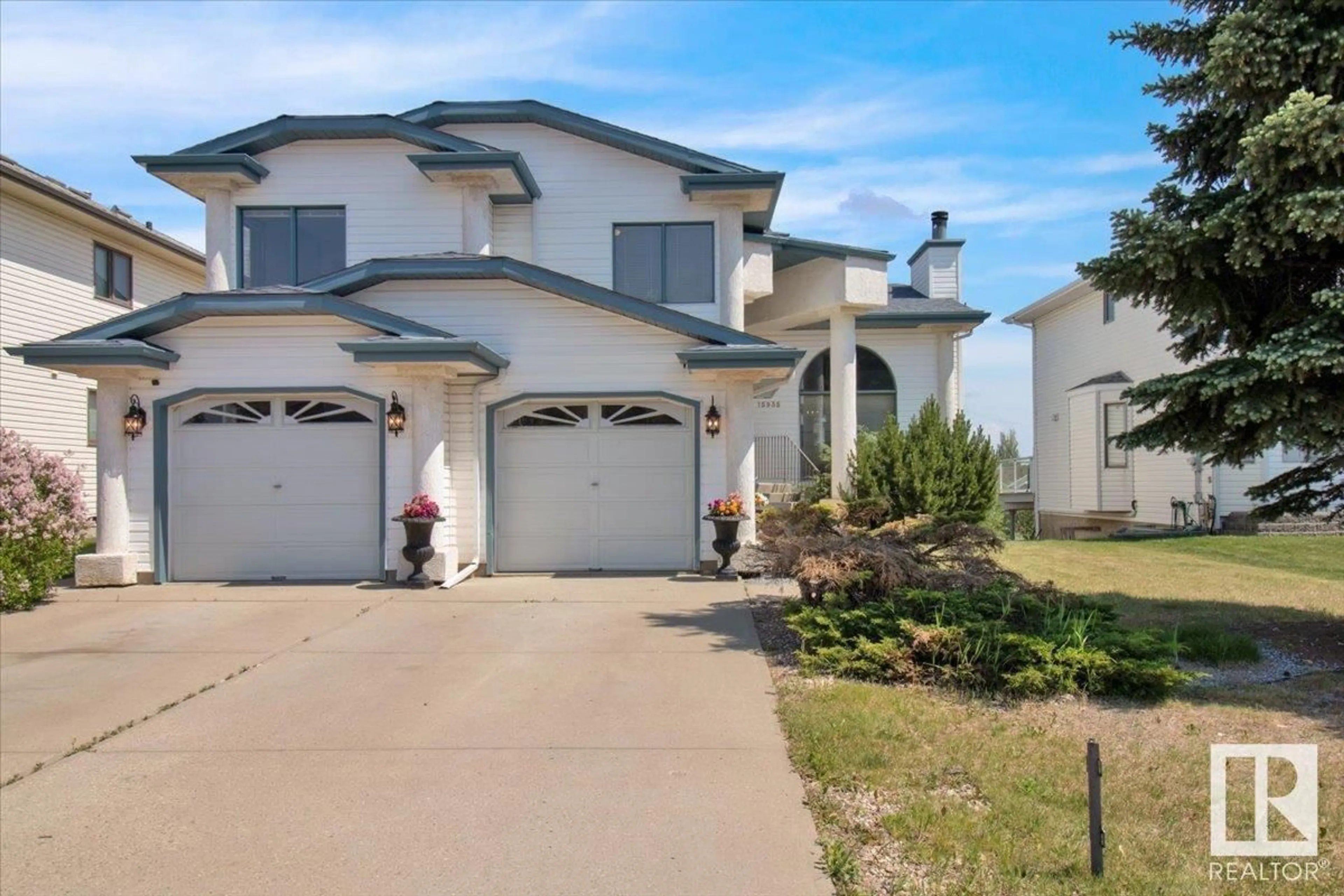 Home with vinyl exterior material, street for NW - 15935 58 ST, Edmonton Alberta T5Y2R5