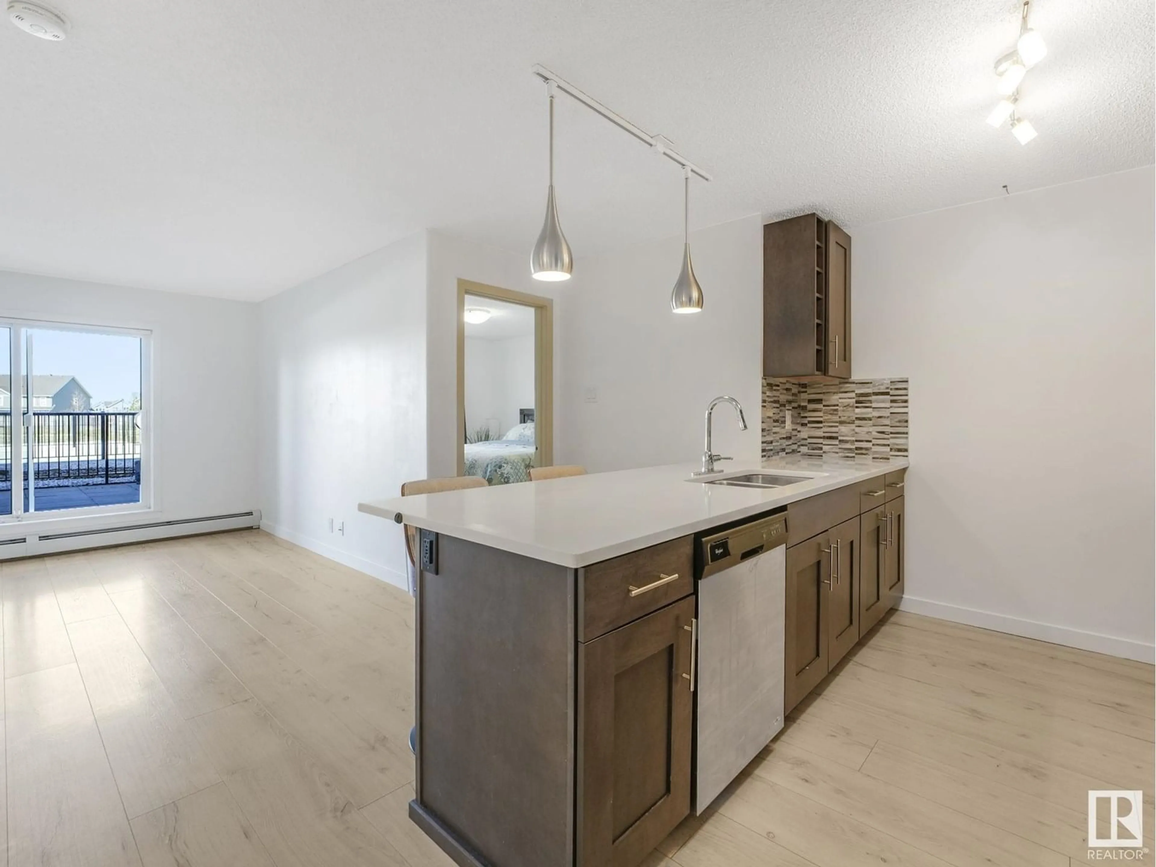 Open concept kitchen, wood/laminate floor for 4008 SAVARYN DR, Edmonton Alberta T6X2E5
