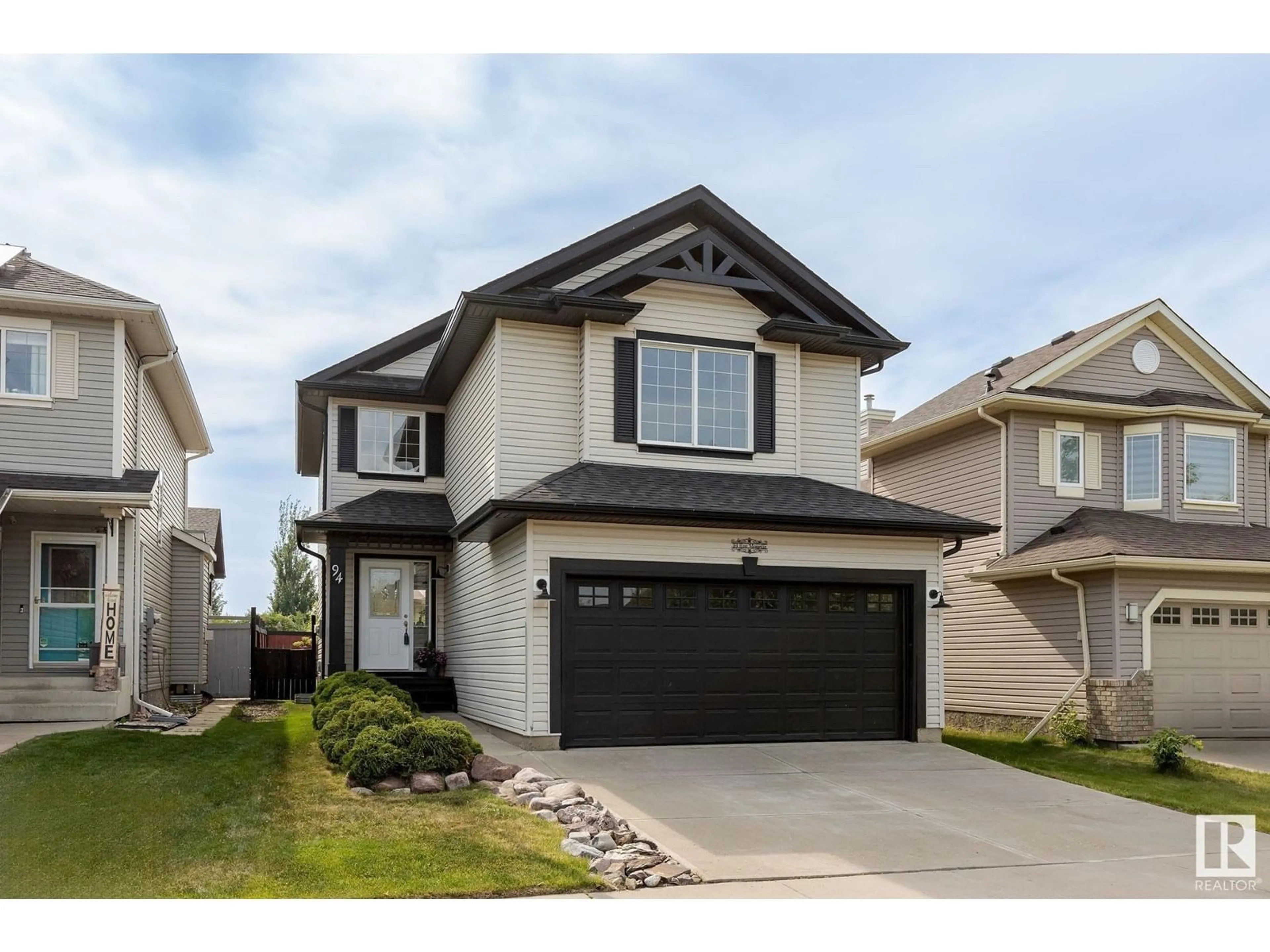 Home with vinyl exterior material, street for 94 RUE MONETTE, Beaumont Alberta T4X1T1