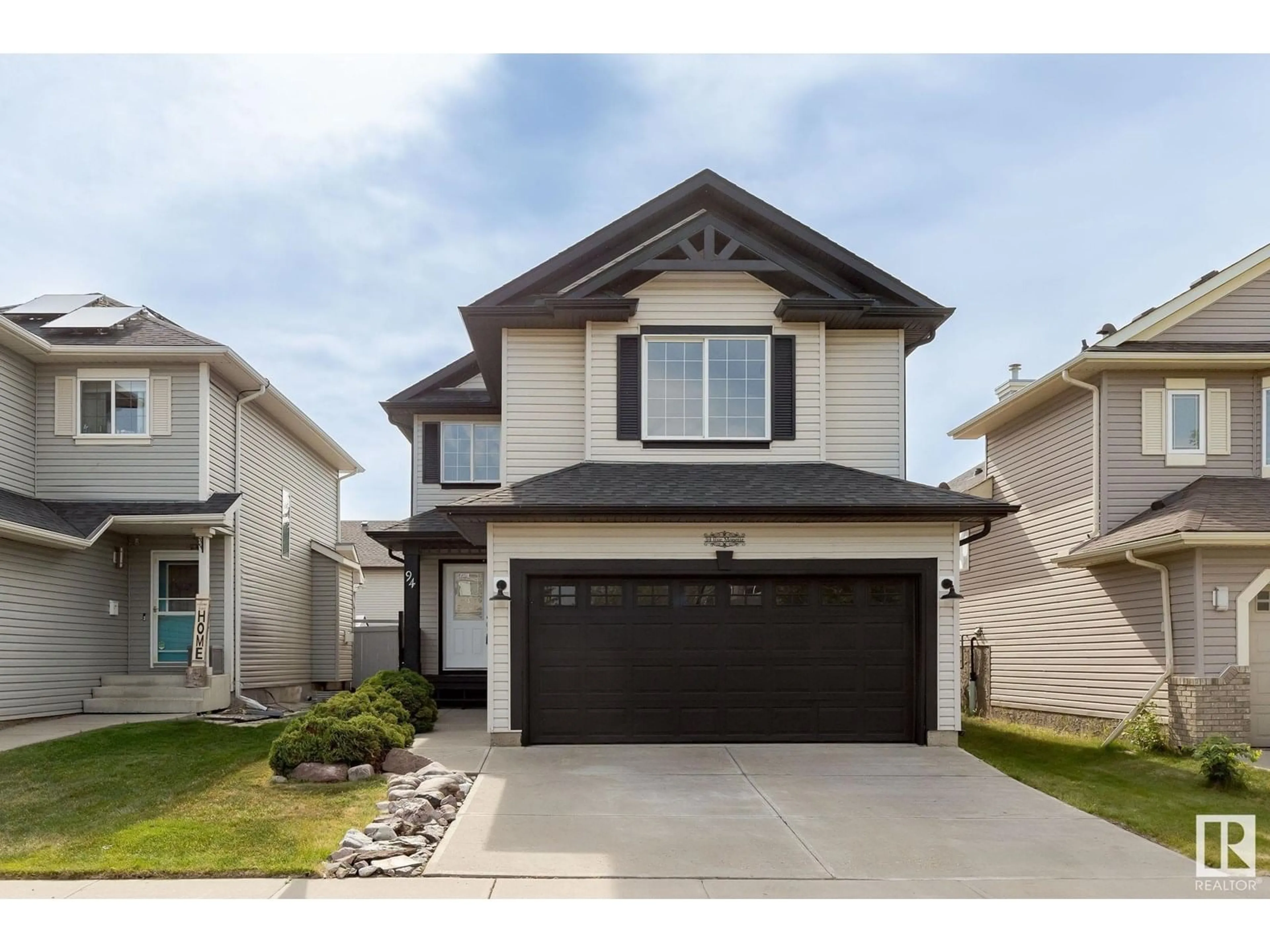 Home with vinyl exterior material, street for 94 RUE MONETTE, Beaumont Alberta T4X1T1