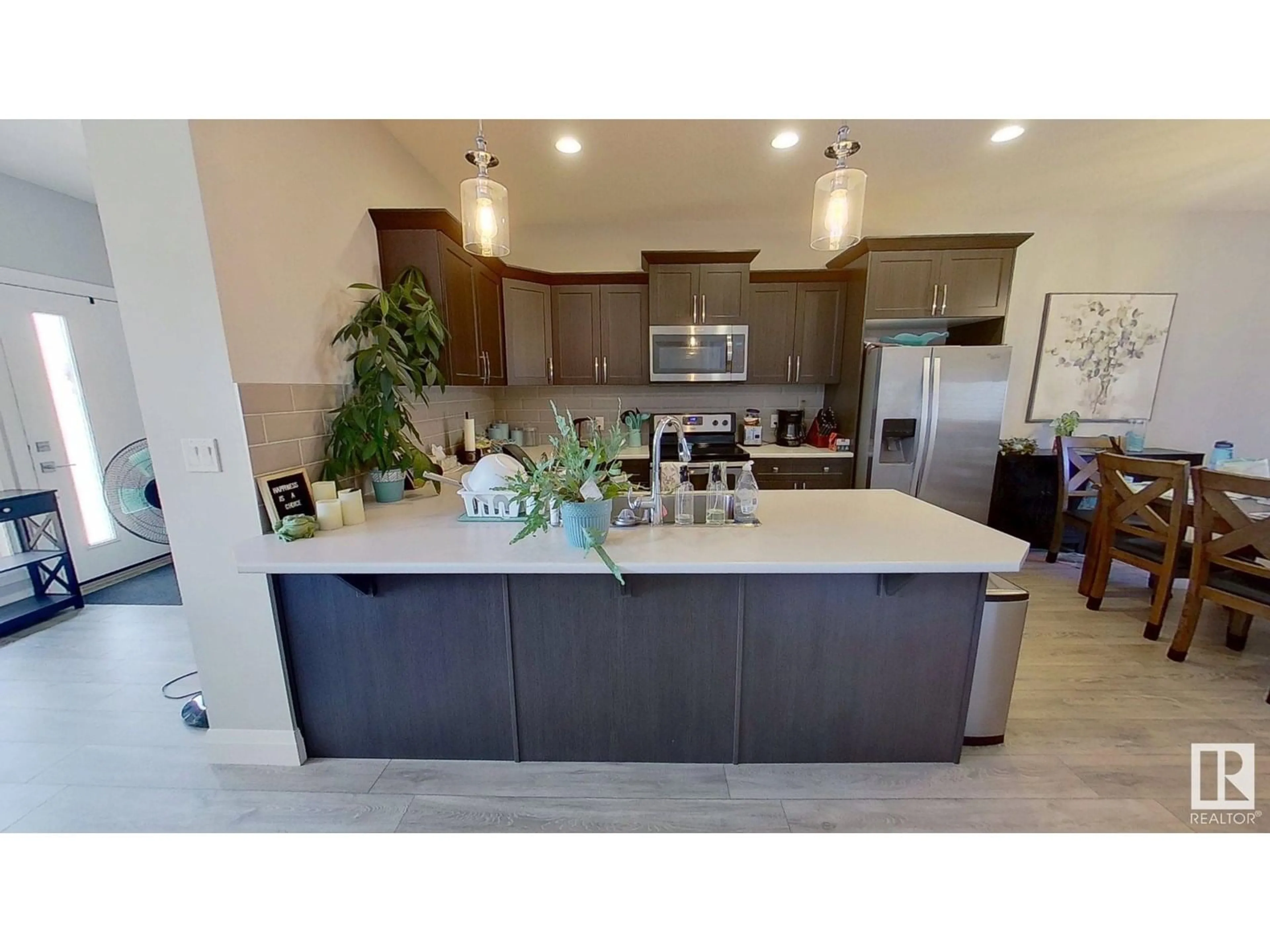 Open concept kitchen, ceramic/tile floor for 3632 8 AV, Edmonton Alberta T6X2G6