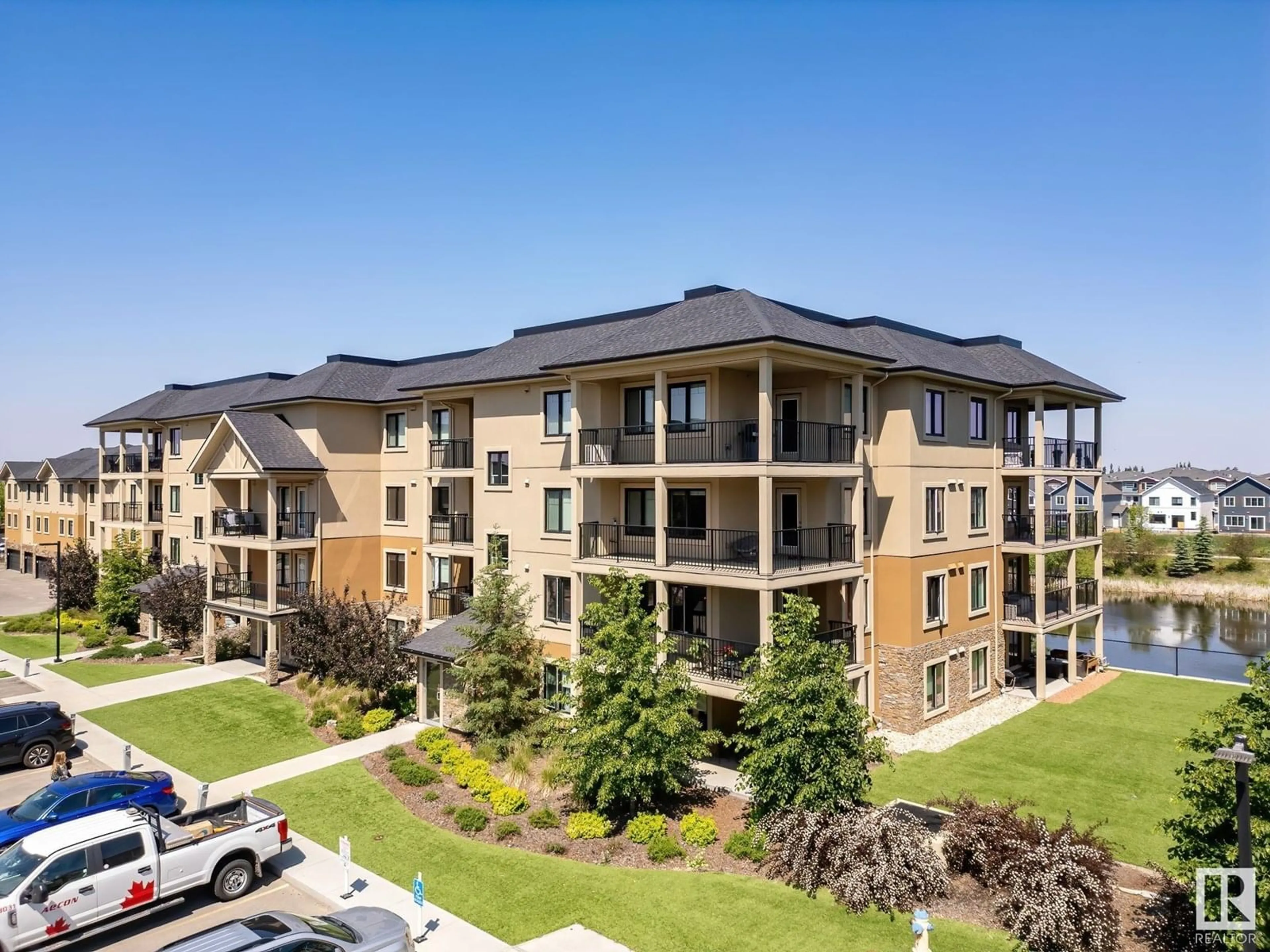 A pic from outside/outdoor area/front of a property/back of a property/a pic from drone, building for #306 - 1027 173 ST, Edmonton Alberta T6W2E4