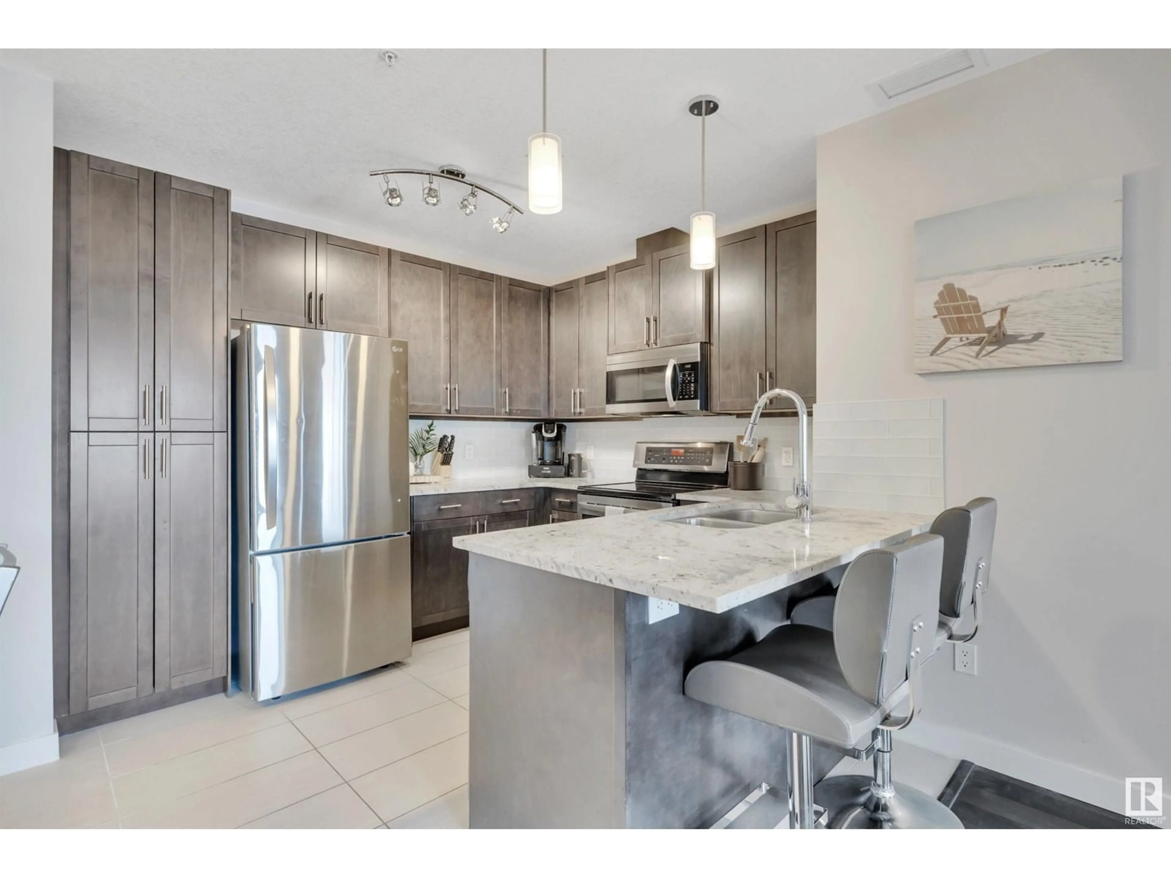 Open concept kitchen, ceramic/tile floor for #214 - 5151 WINDERMERE BV, Edmonton Alberta T6W2K4