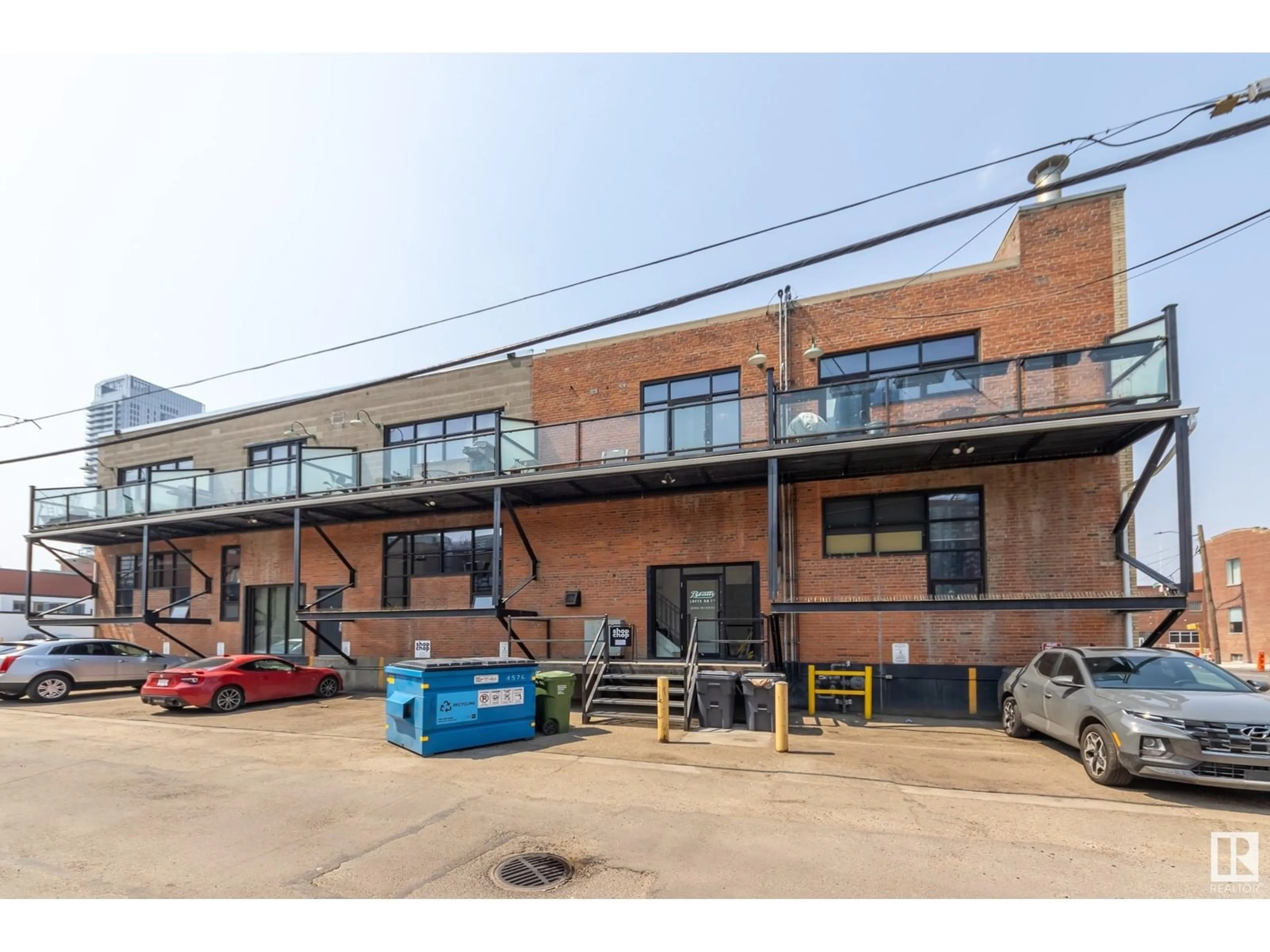 A pic from outside/outdoor area/front of a property/back of a property/a pic from drone, building for #104 - 10265 107 ST NW, Edmonton Alberta T5J5G2