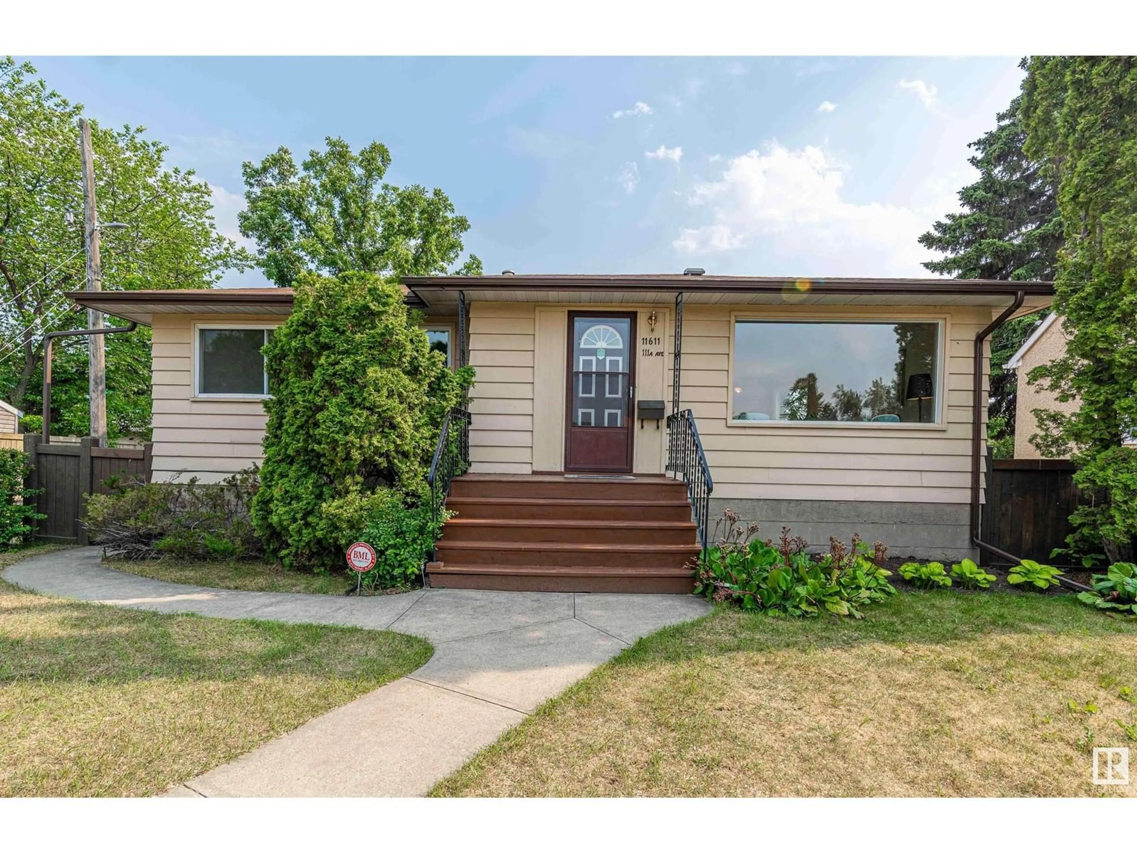Home with vinyl exterior material, street for 11611 111A AV, Edmonton Alberta T5G0G2
