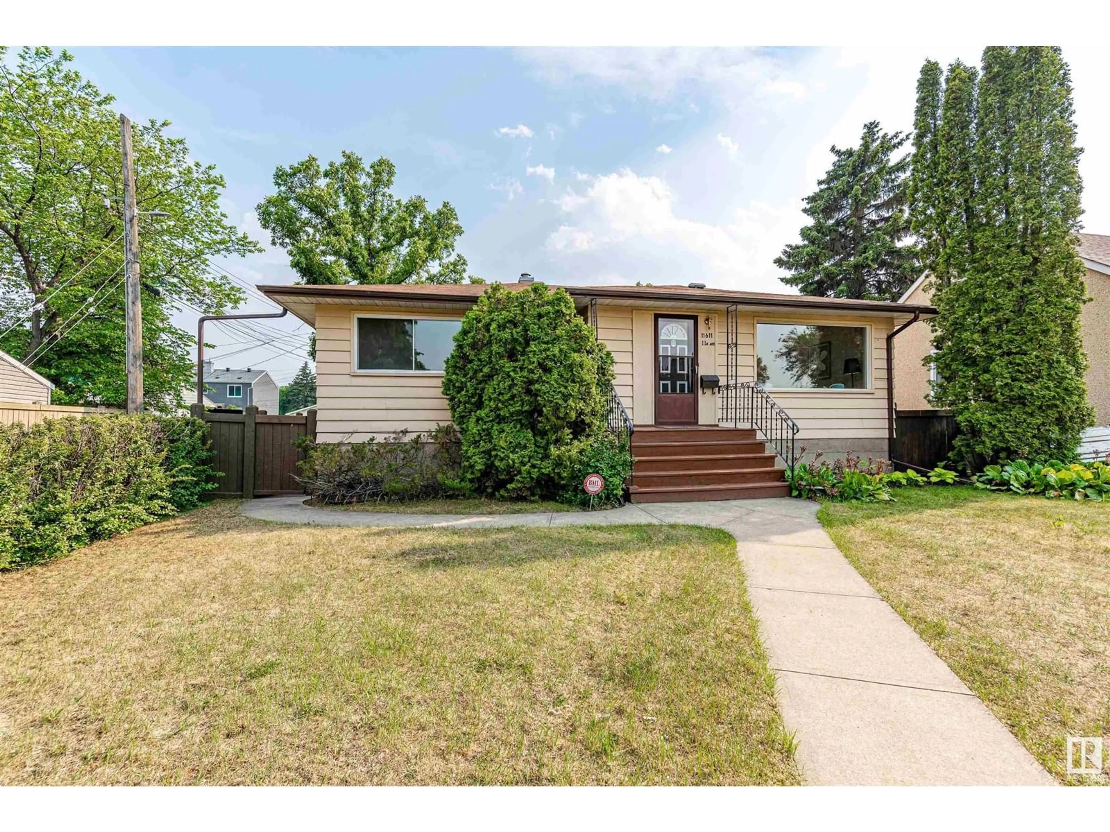 Home with vinyl exterior material, street for 11611 111A AV, Edmonton Alberta T5G0G2