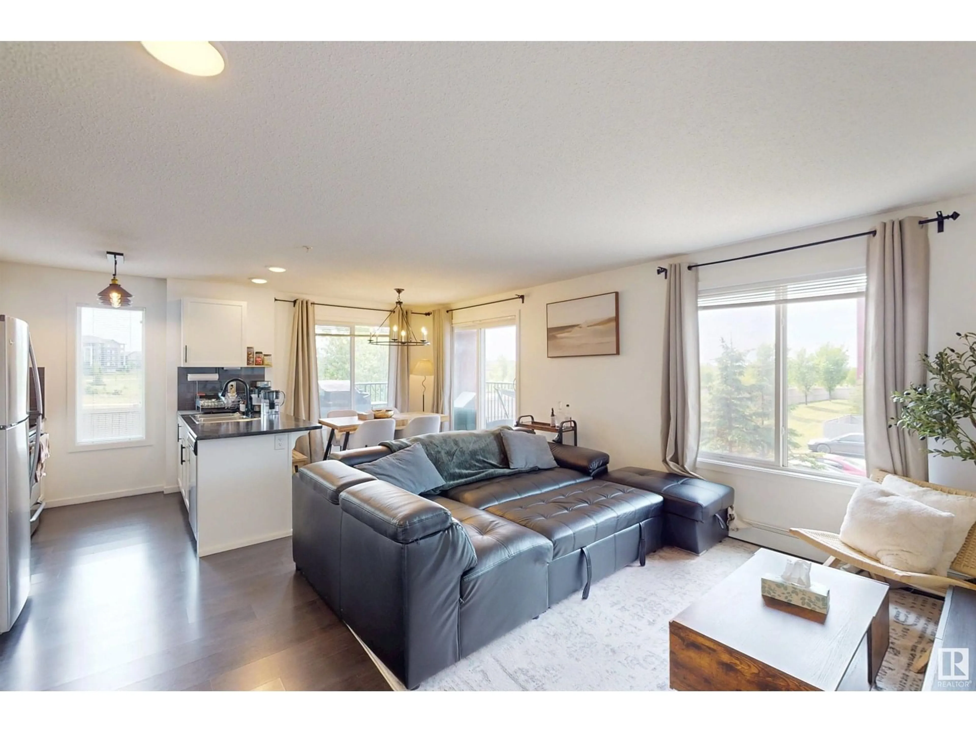 Living room with furniture, wood/laminate floor for 236 5515 7 AVE, Edmonton Alberta T6X2A8
