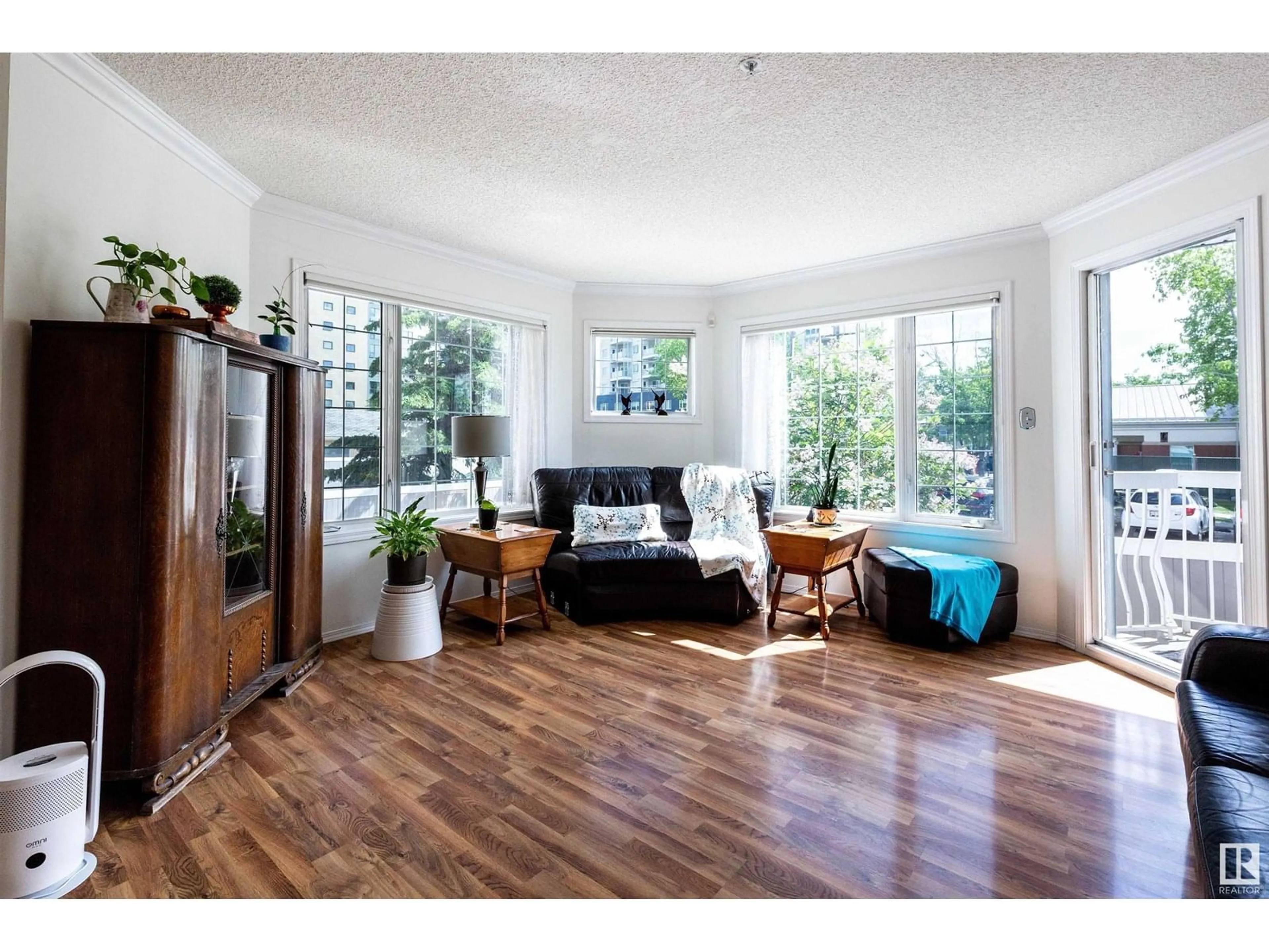 Living room with furniture, wood/laminate floor for #106 - 13450 114 AV, Edmonton Alberta T5M4C4