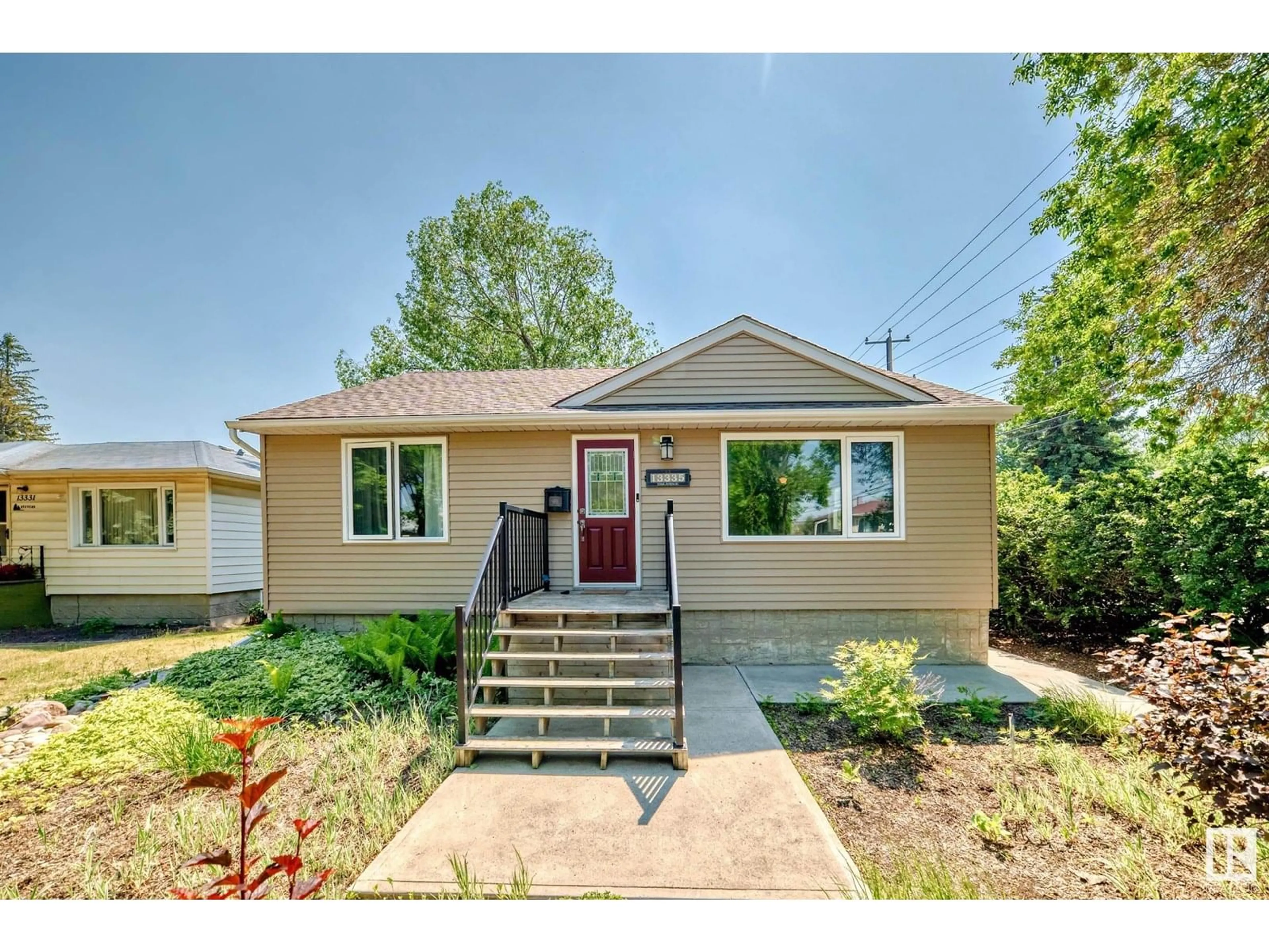 Home with vinyl exterior material, street for NW - 13335 110A AV, Edmonton Alberta T5M2M6