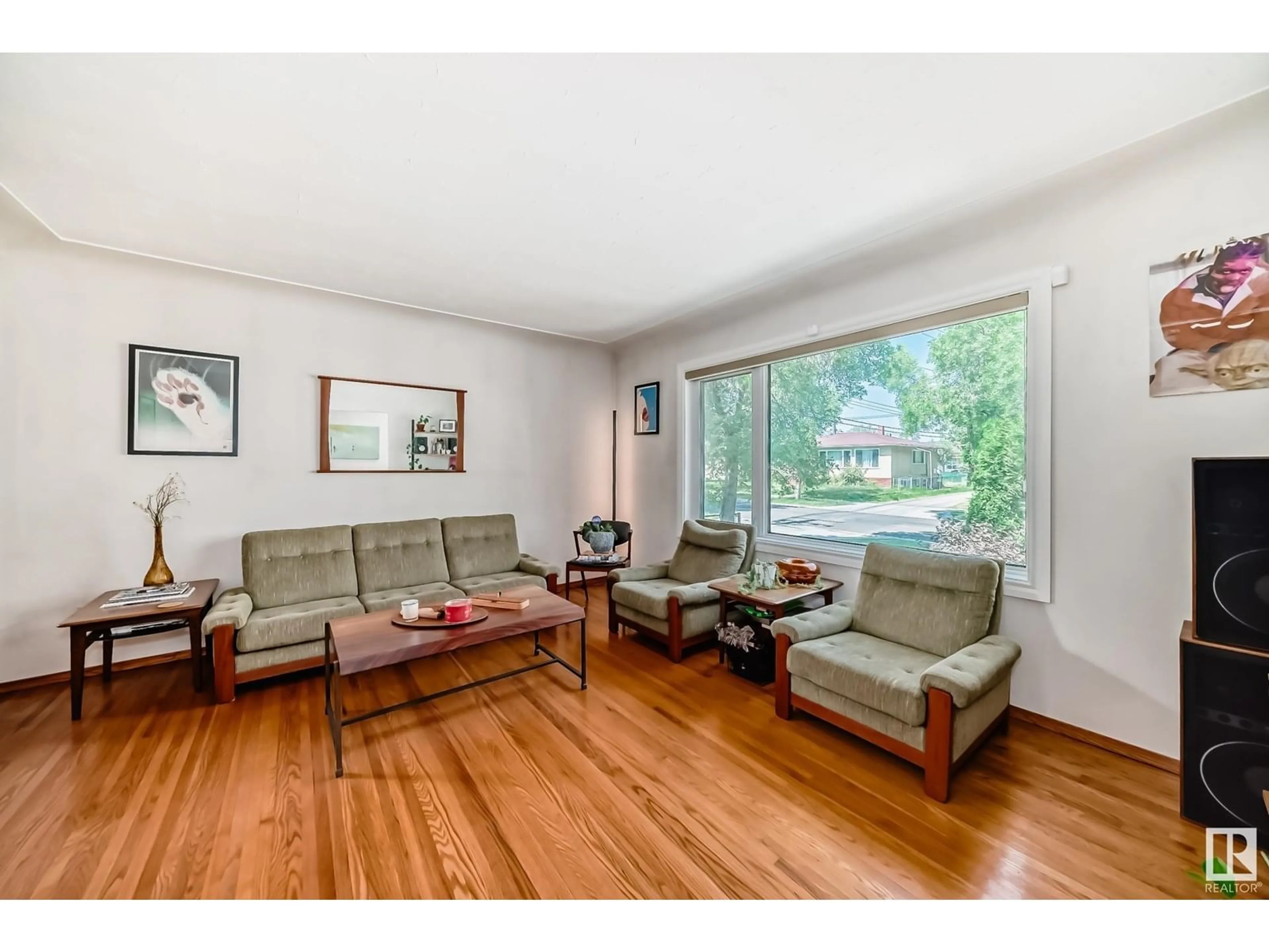 Living room with furniture, wood/laminate floor for NW - 13335 110A AV, Edmonton Alberta T5M2M6