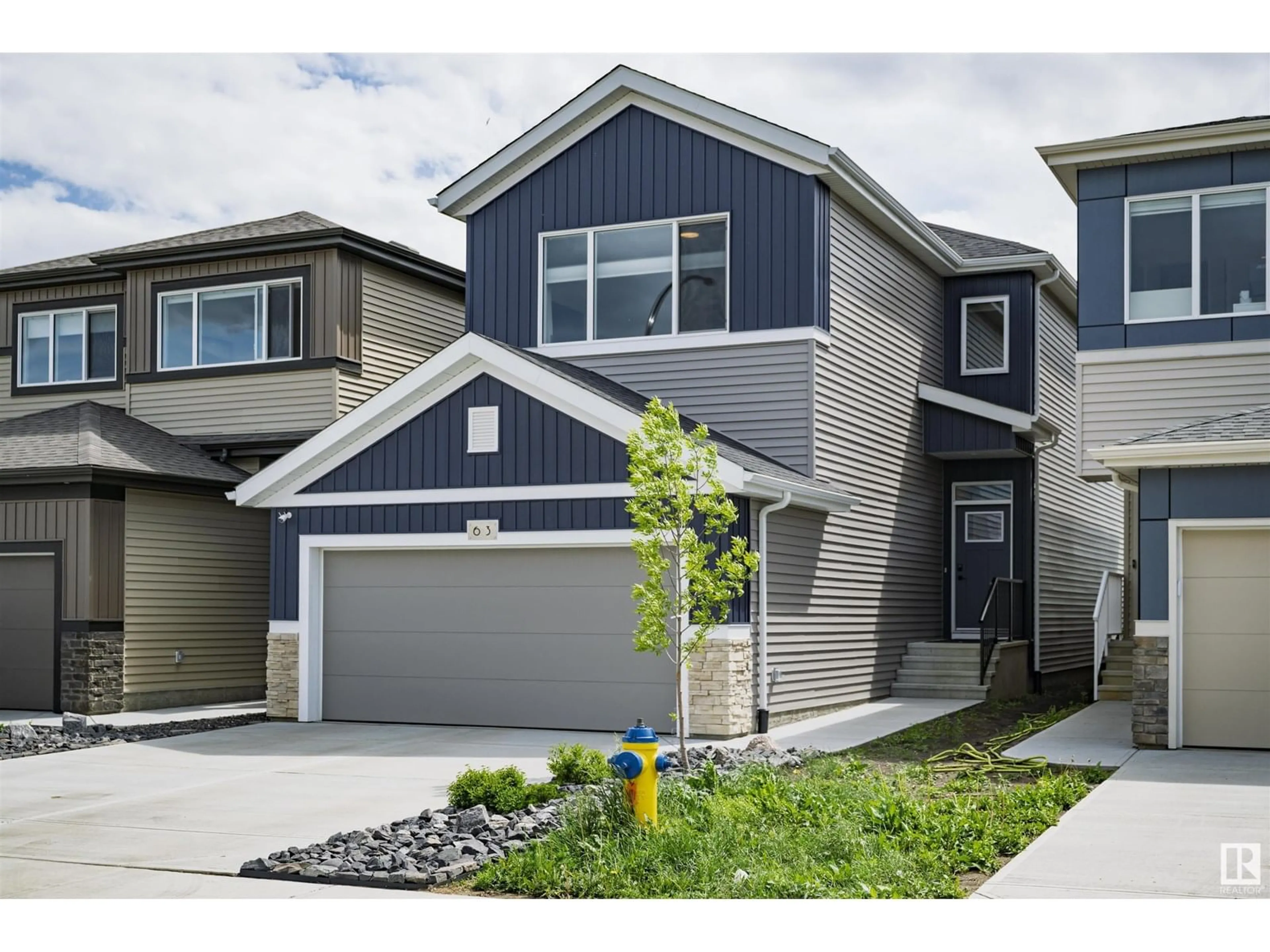 Home with vinyl exterior material, street for 63 ELSINORE PL, Edmonton Alberta T5X0M5