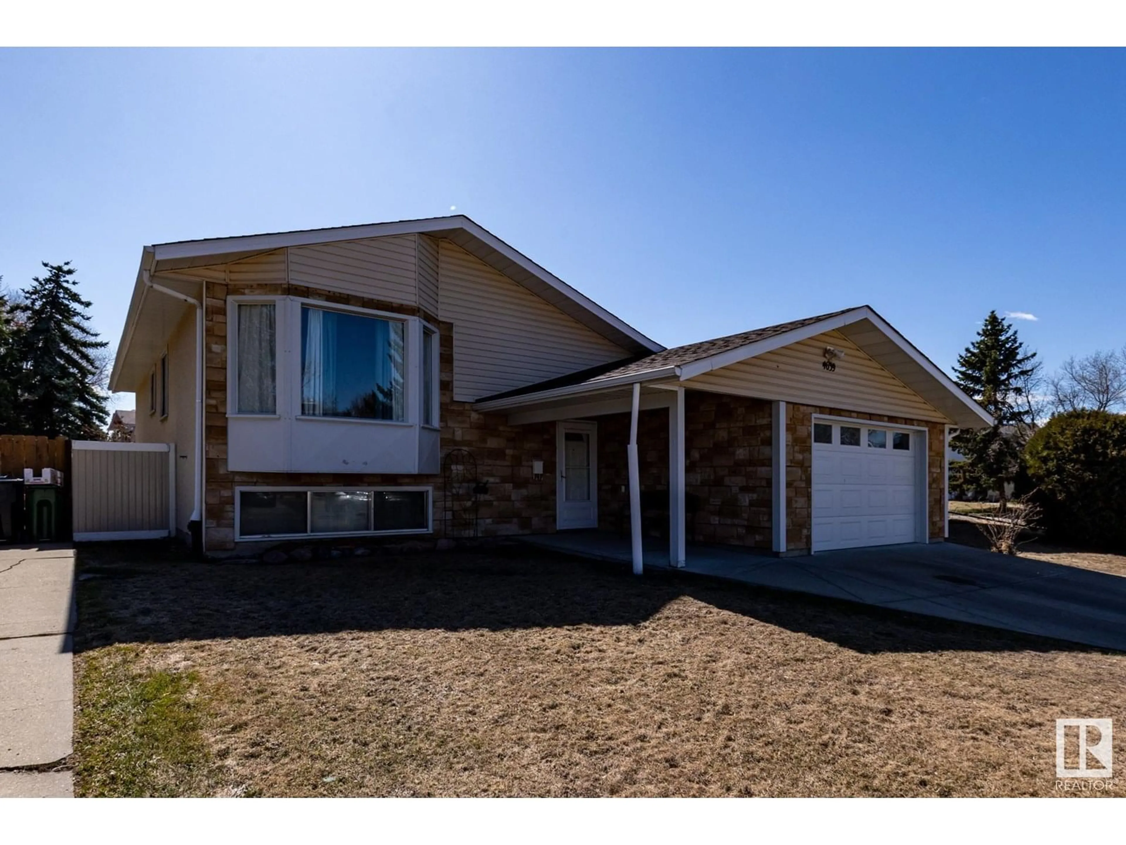 Home with vinyl exterior material, street for 4639 17 AV, Edmonton Alberta T6L2Z4
