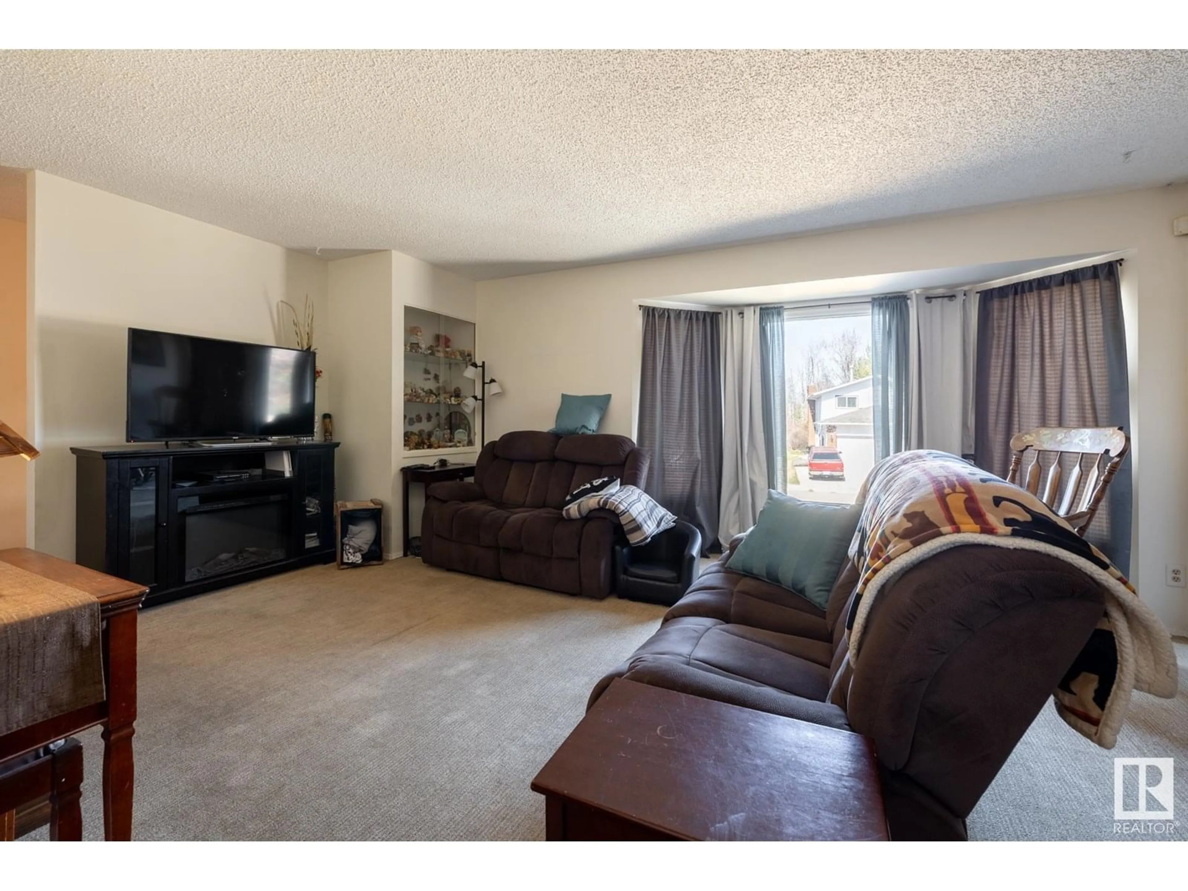 Living room with furniture, unknown for 4639 17 AV, Edmonton Alberta T6L2Z4