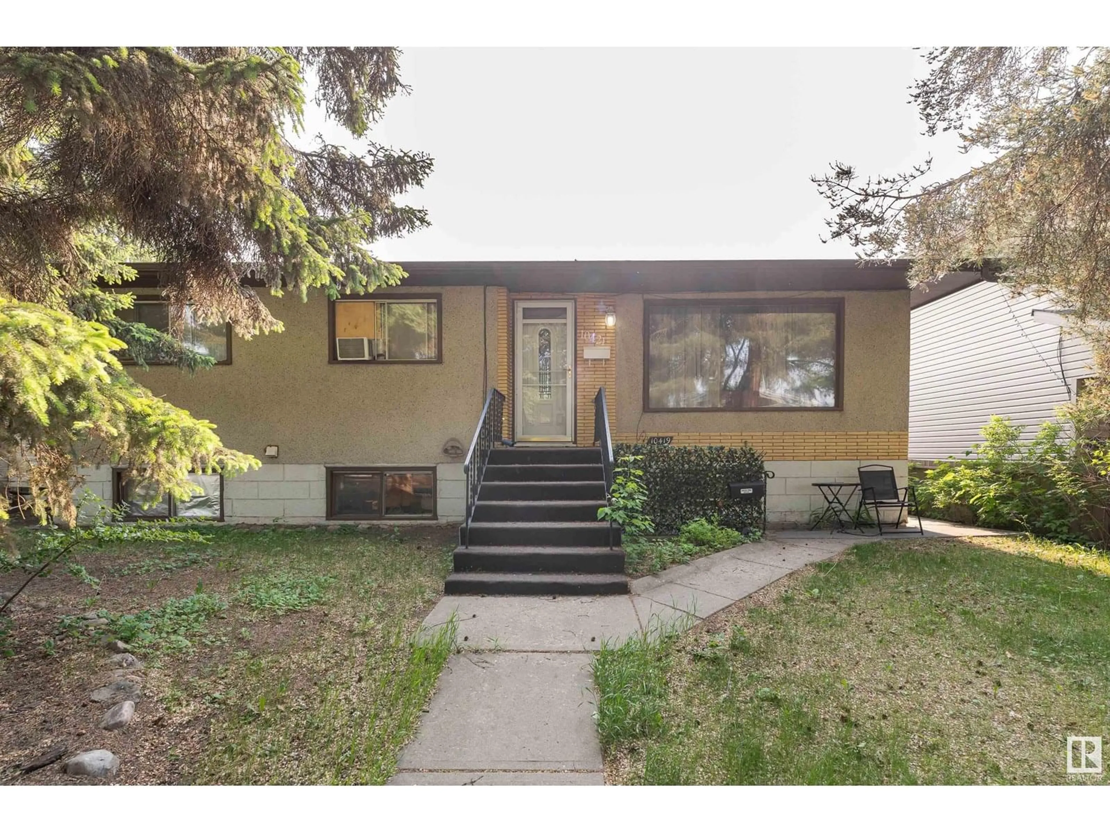 Home with vinyl exterior material, street for 10421 - 10419 78 ST, Edmonton Alberta T6A3E7