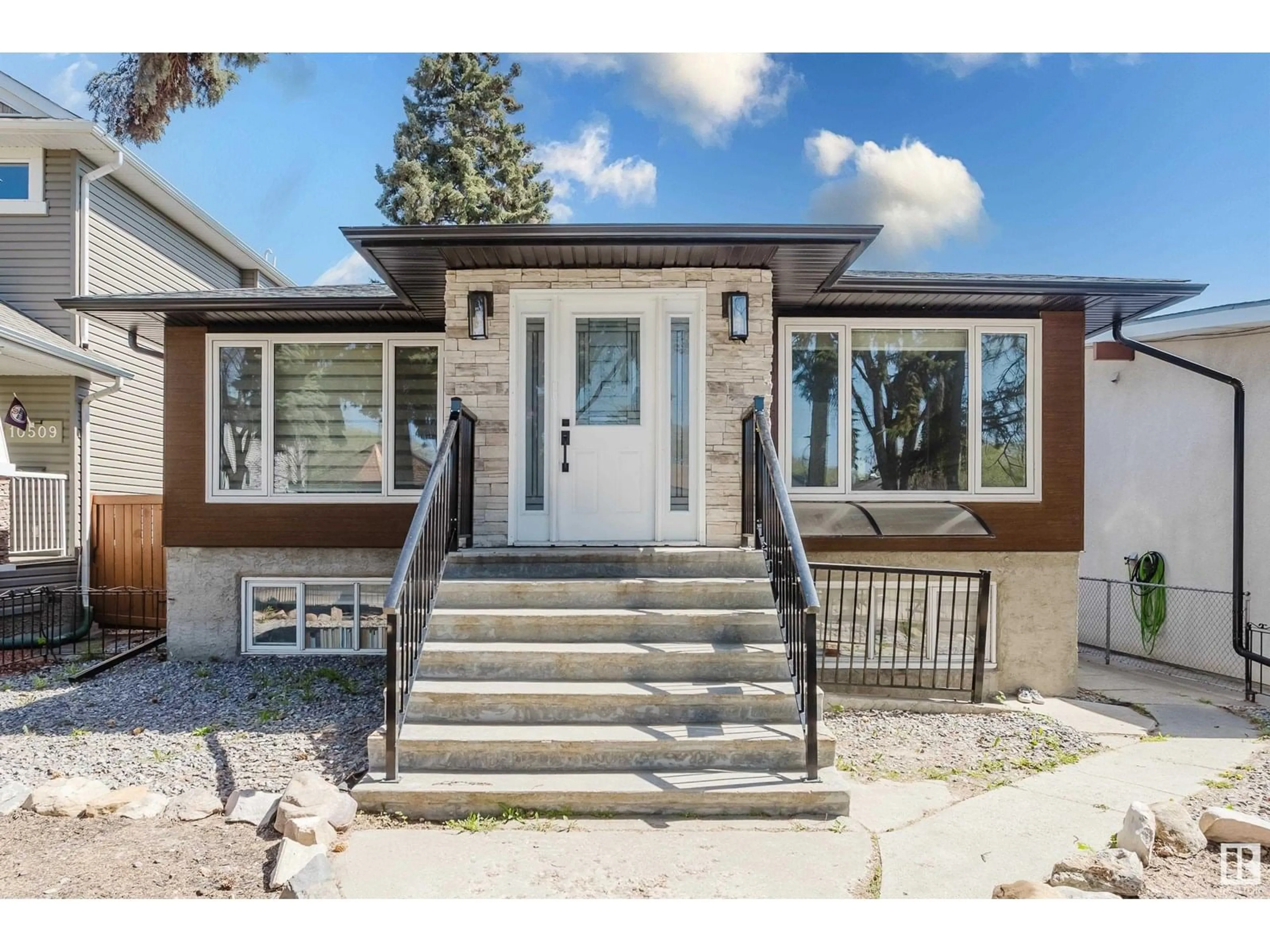 Home with vinyl exterior material, street for 10505 76 ST, Edmonton Alberta T6A3B2