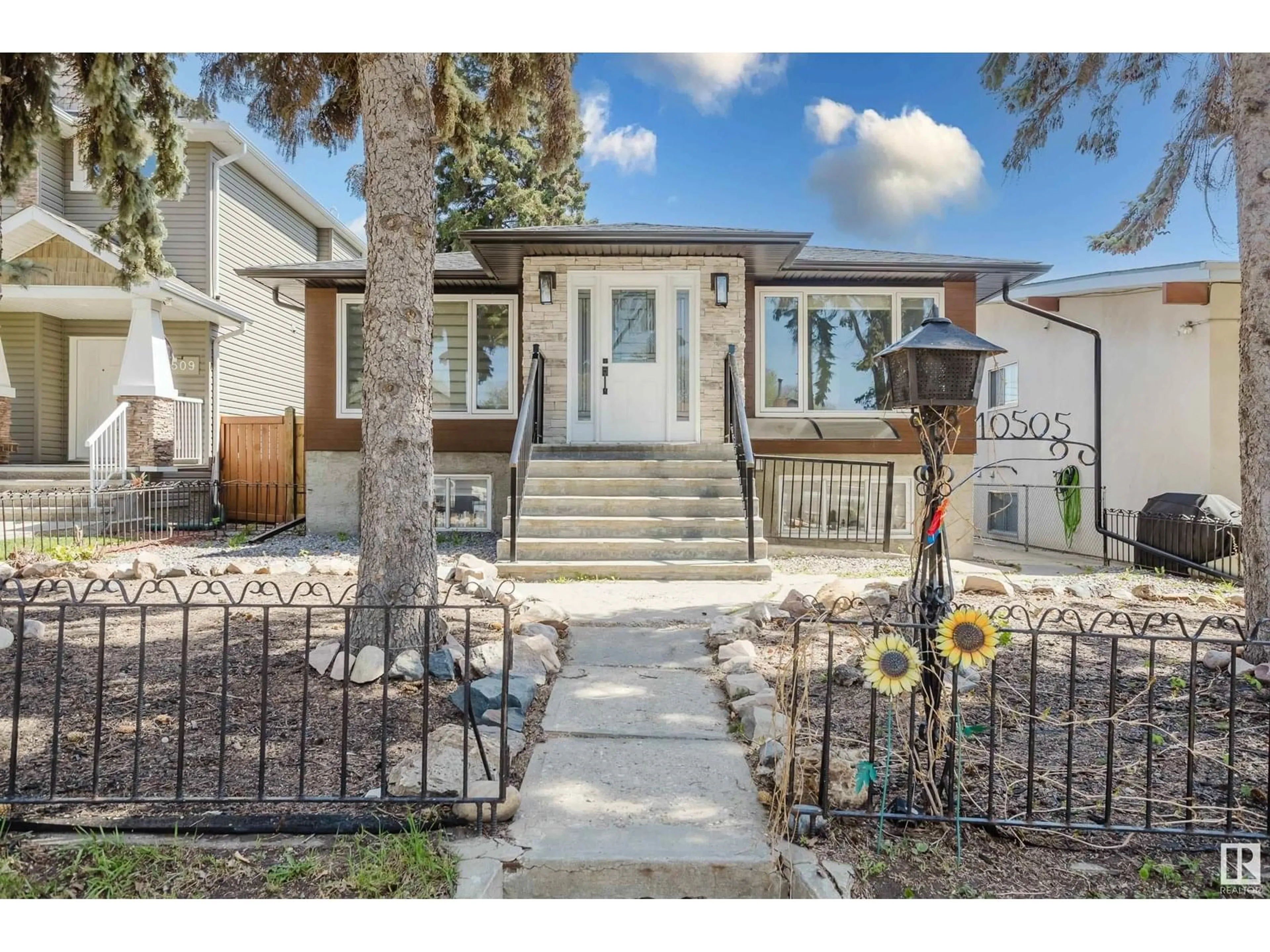 Home with vinyl exterior material, street for 10505 76 ST, Edmonton Alberta T6A3B2