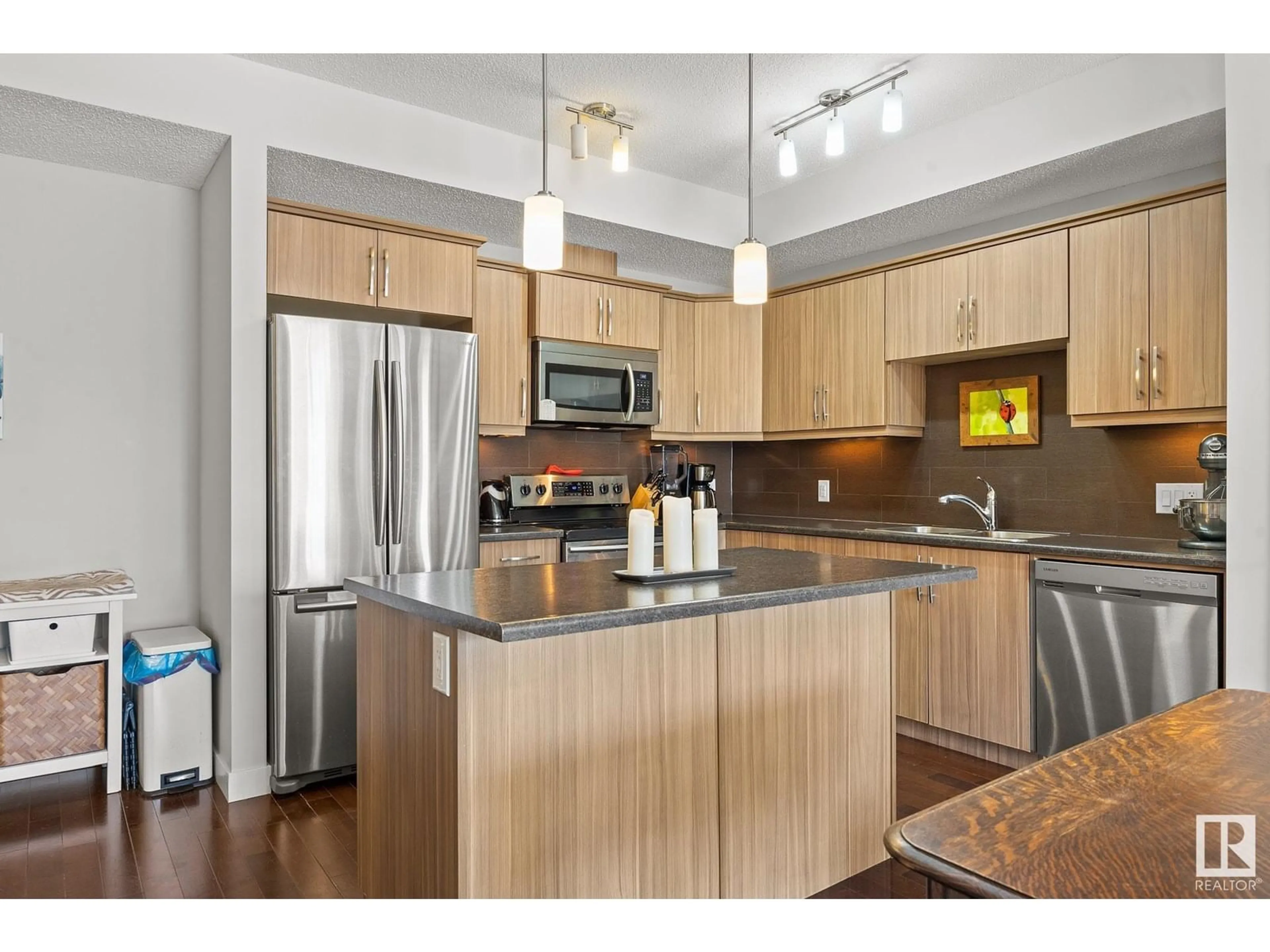 Open concept kitchen, wood/laminate floor for #202 - 10523 123 ST, Edmonton Alberta T5N1N9