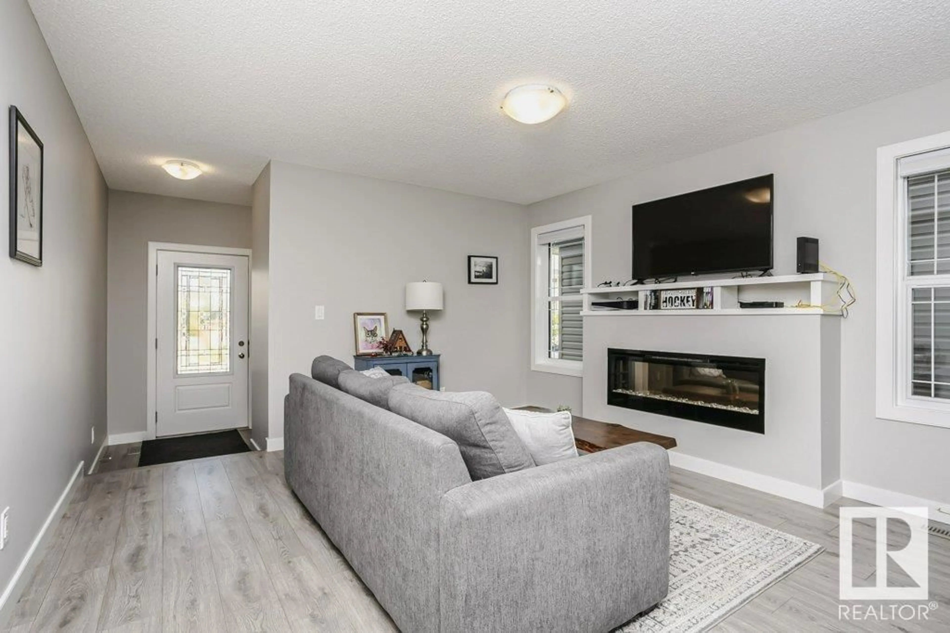 Living room with furniture, unknown for 20104 18 AV, Edmonton Alberta T6J4T9