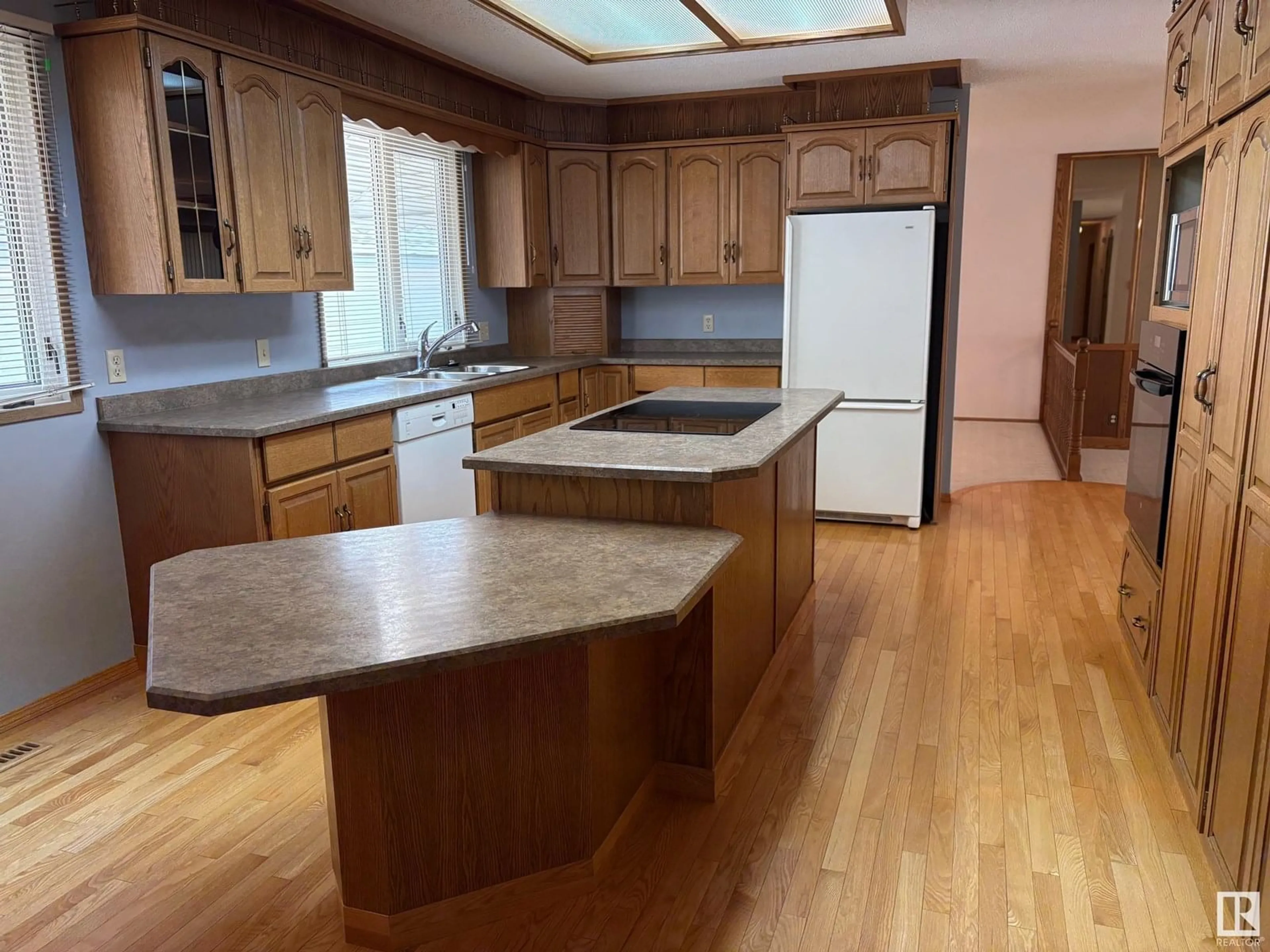 Open concept kitchen, wood/laminate floor for 4505 53 ST, Vegreville Alberta T9C1L4