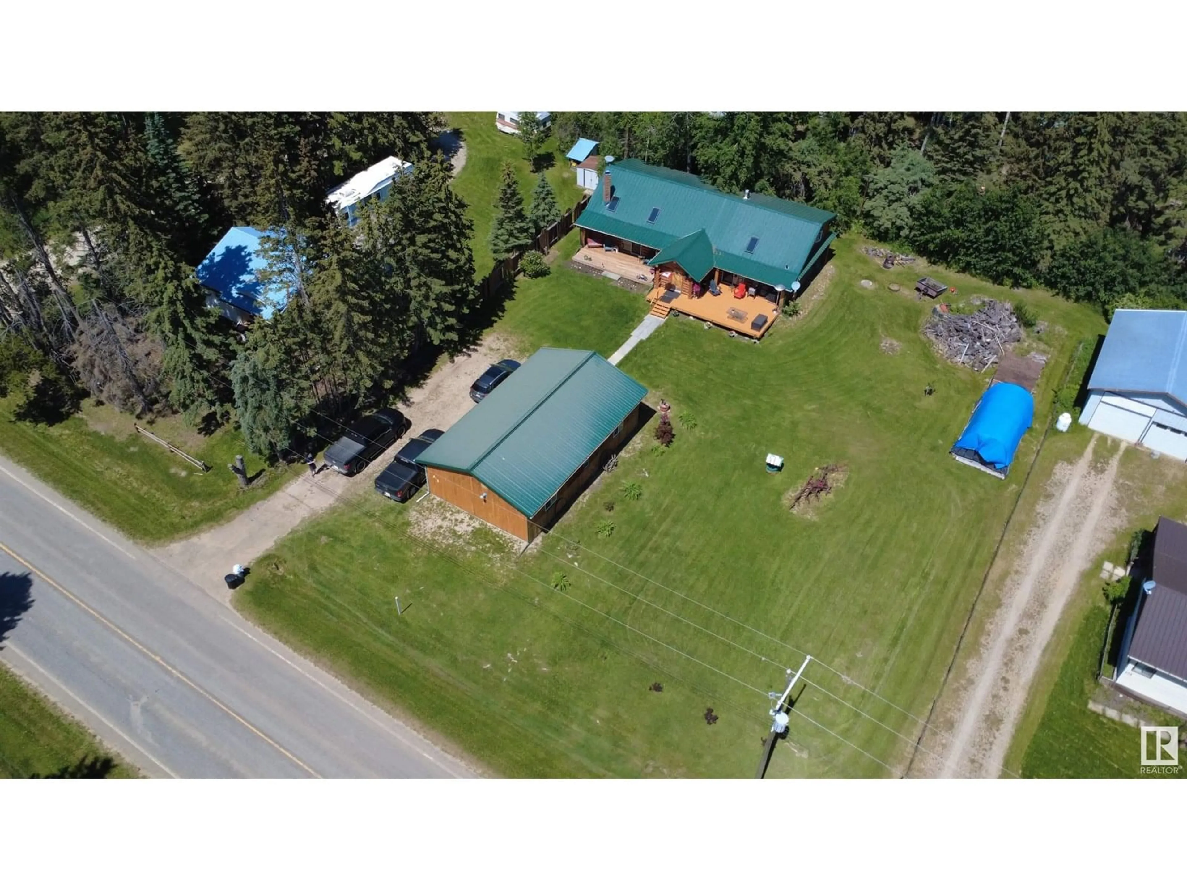 A pic from outside/outdoor area/front of a property/back of a property/a pic from drone, building for 312 LAKESHORE DR, Rural Wetaskiwin County Alberta T0C0T0