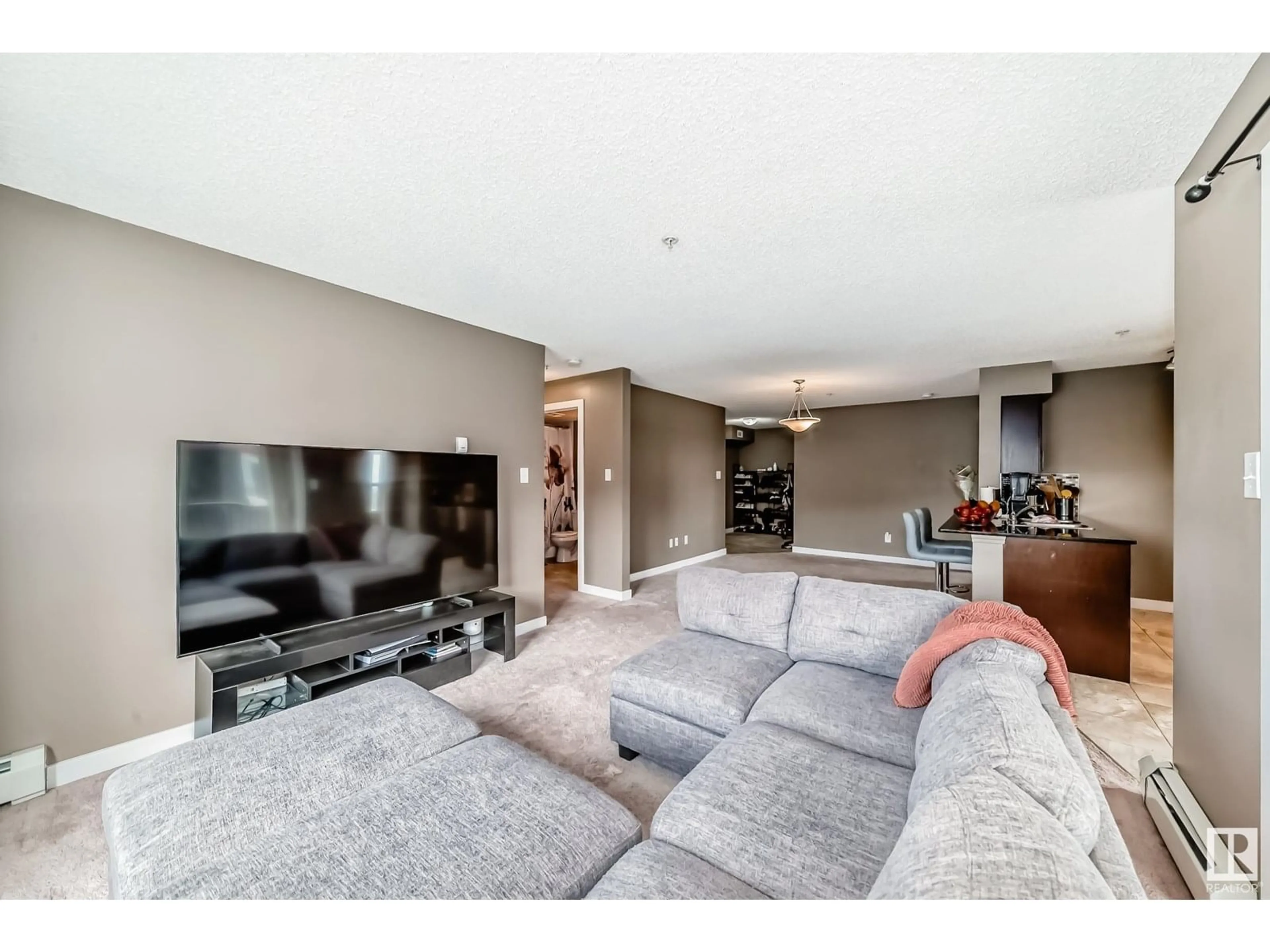Living room with furniture, unknown for #324 - 274 MCCONACHIE DR, Edmonton Alberta T5Y3N4