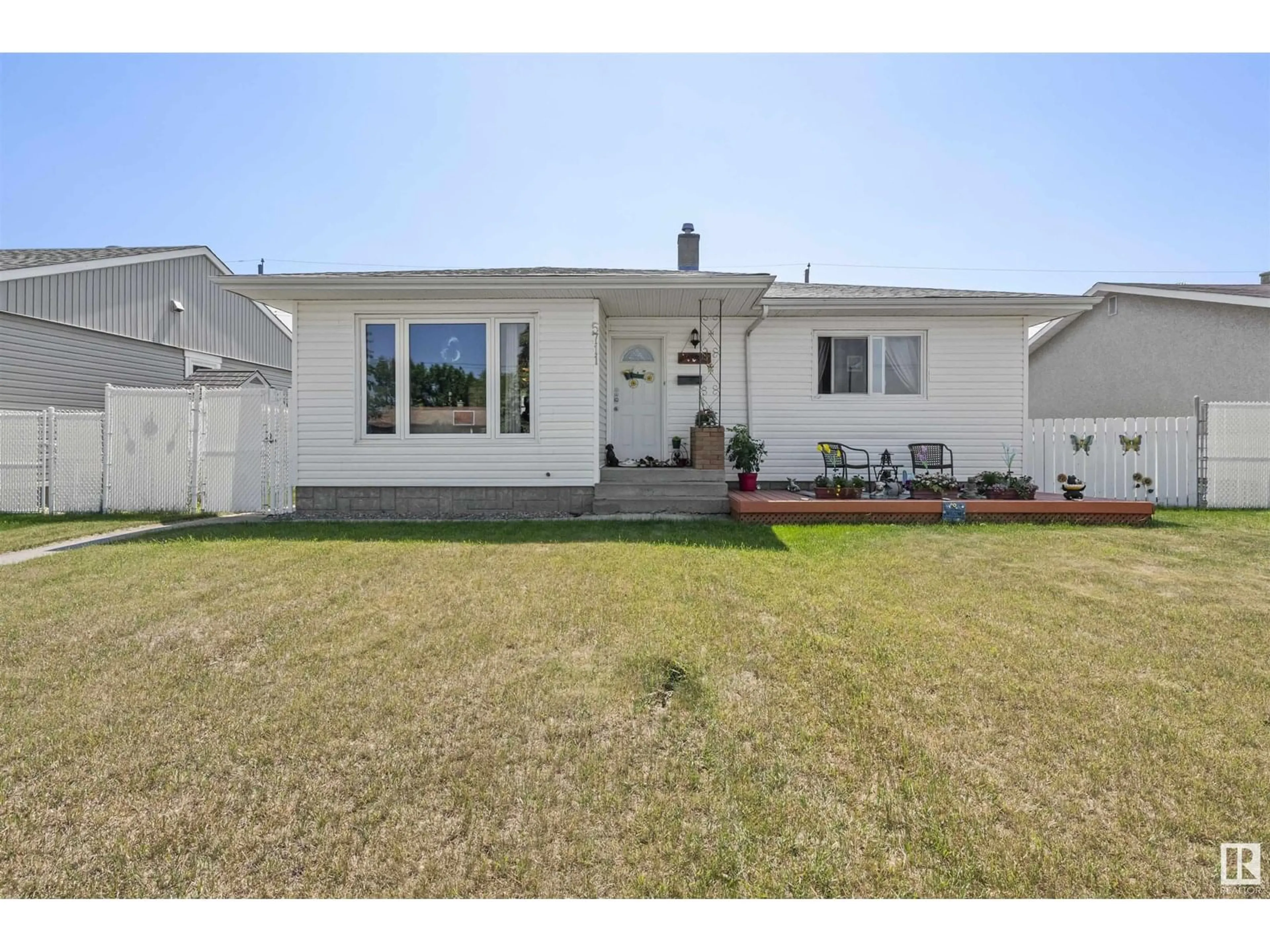 Home with vinyl exterior material, street for 5711 102A AV, Edmonton Alberta T6A0R5