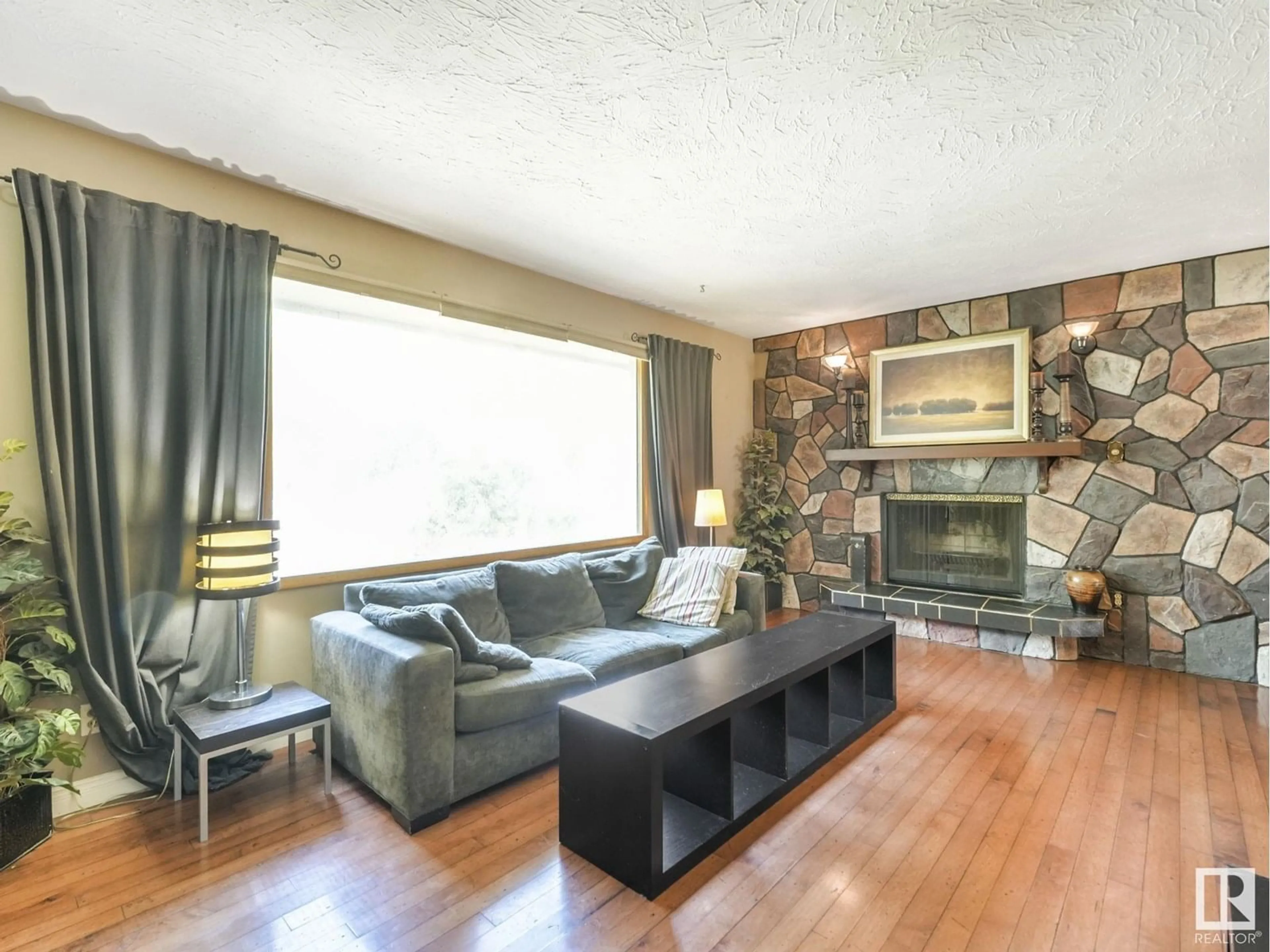 Living room with furniture, wood/laminate floor for NW - 8905 156 ST, Edmonton Alberta T5R1Y6