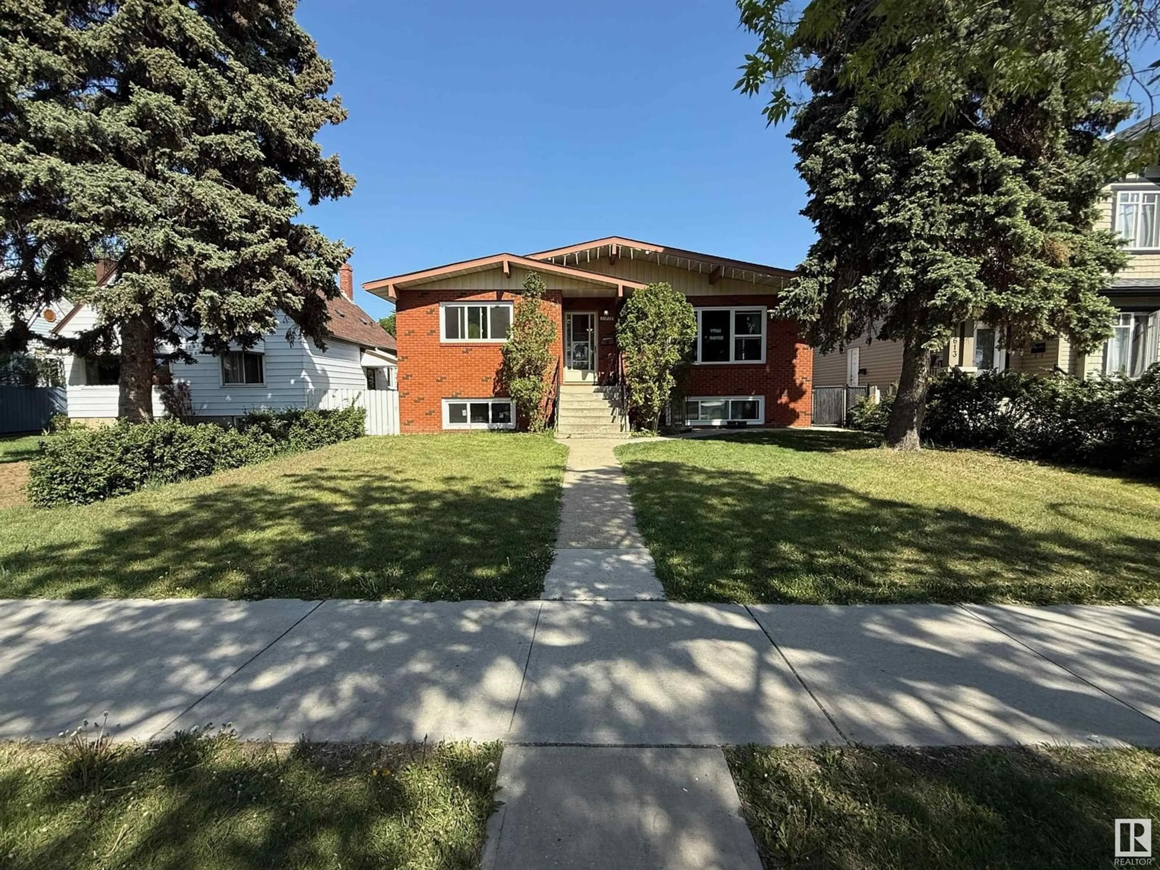 Home with brick exterior material, street for NW - 11615 102 ST, Edmonton Alberta T5G2E9