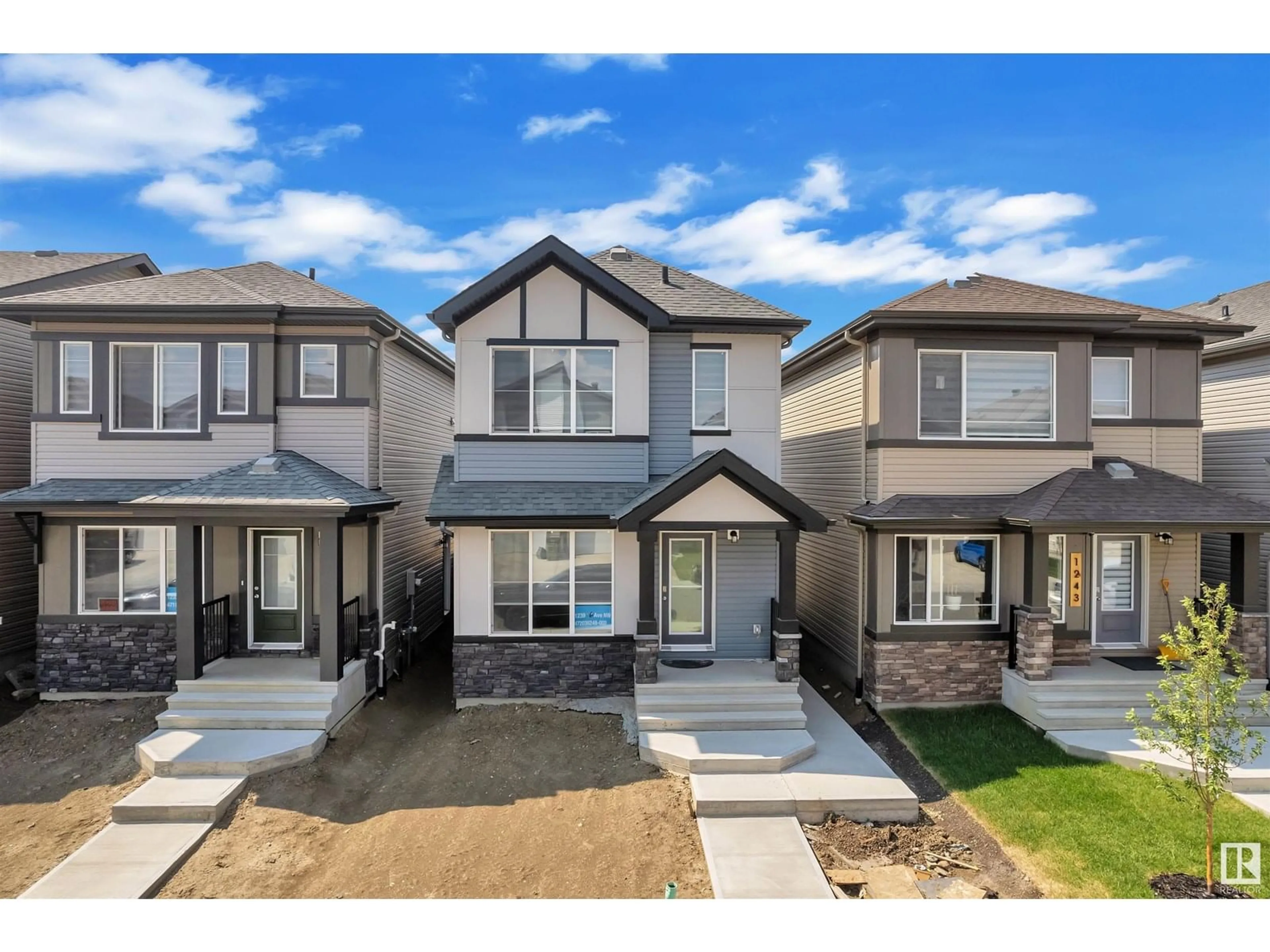 Home with vinyl exterior material, street for NW - 1239 16 AV, Edmonton Alberta T5J3S9