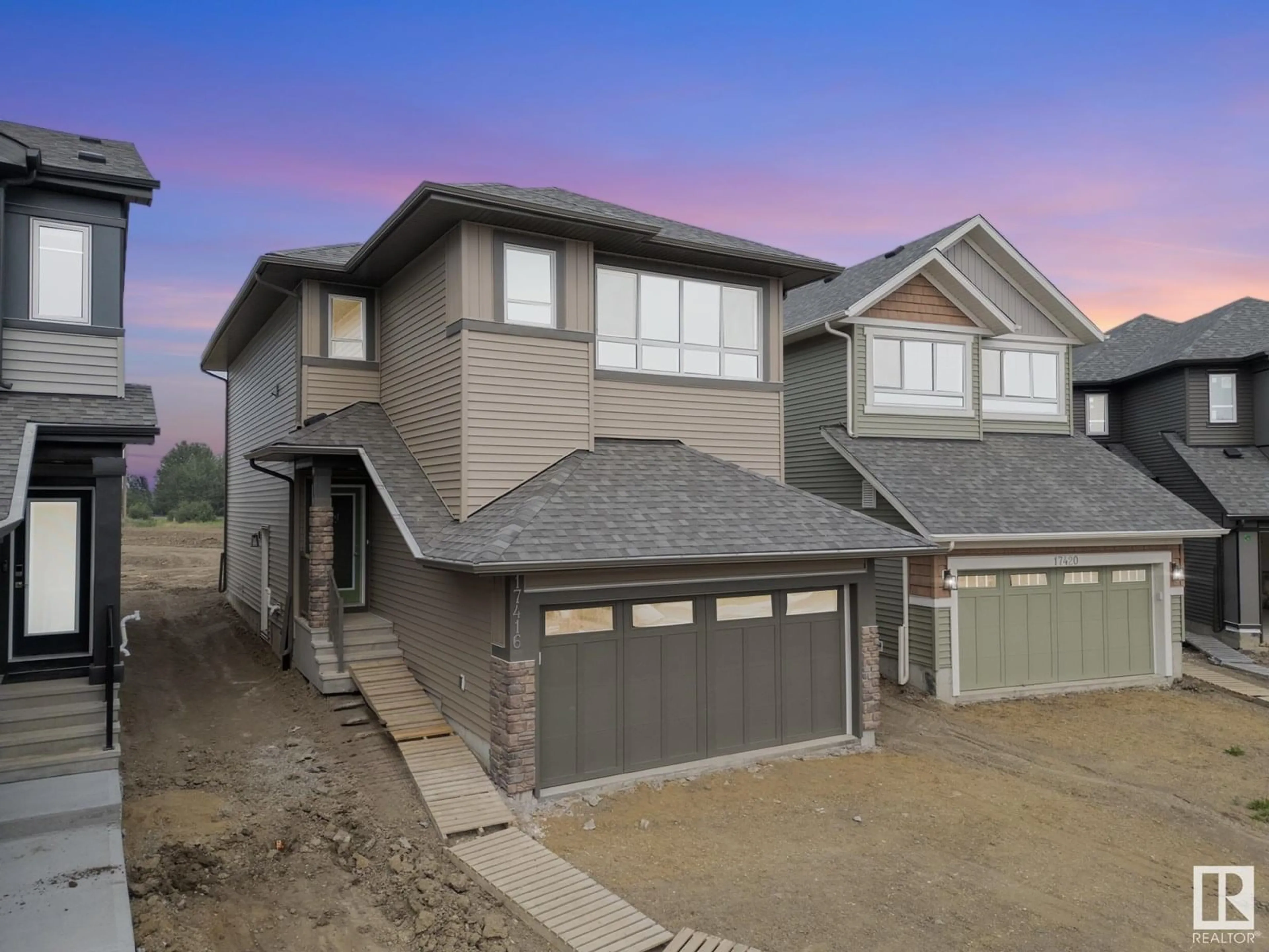 Home with vinyl exterior material, street for 17416 3 ST, Edmonton Alberta T5Y4G7