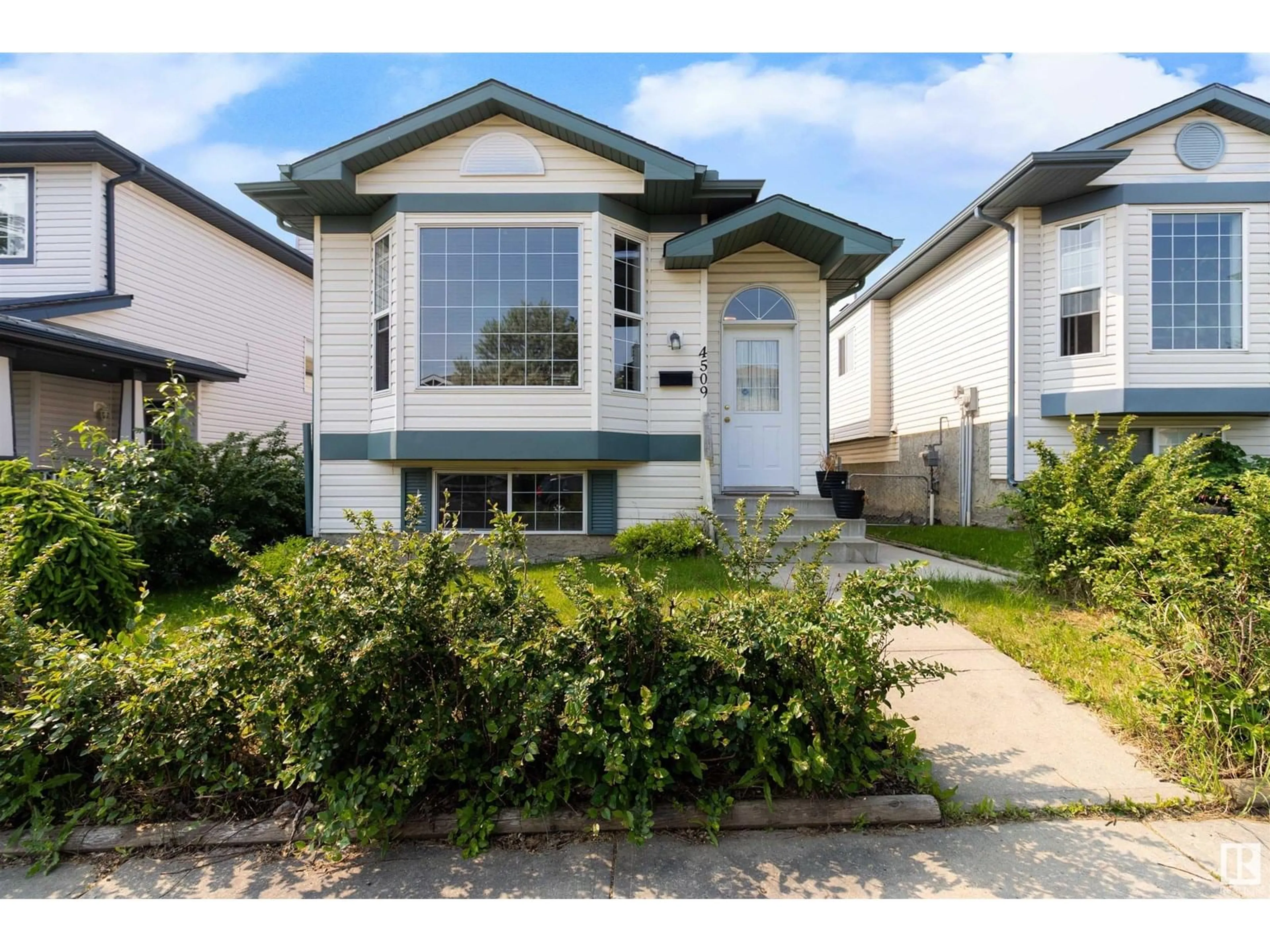 Home with vinyl exterior material, street for NW - 4509 150 AV, Edmonton Alberta T5Y2Z8