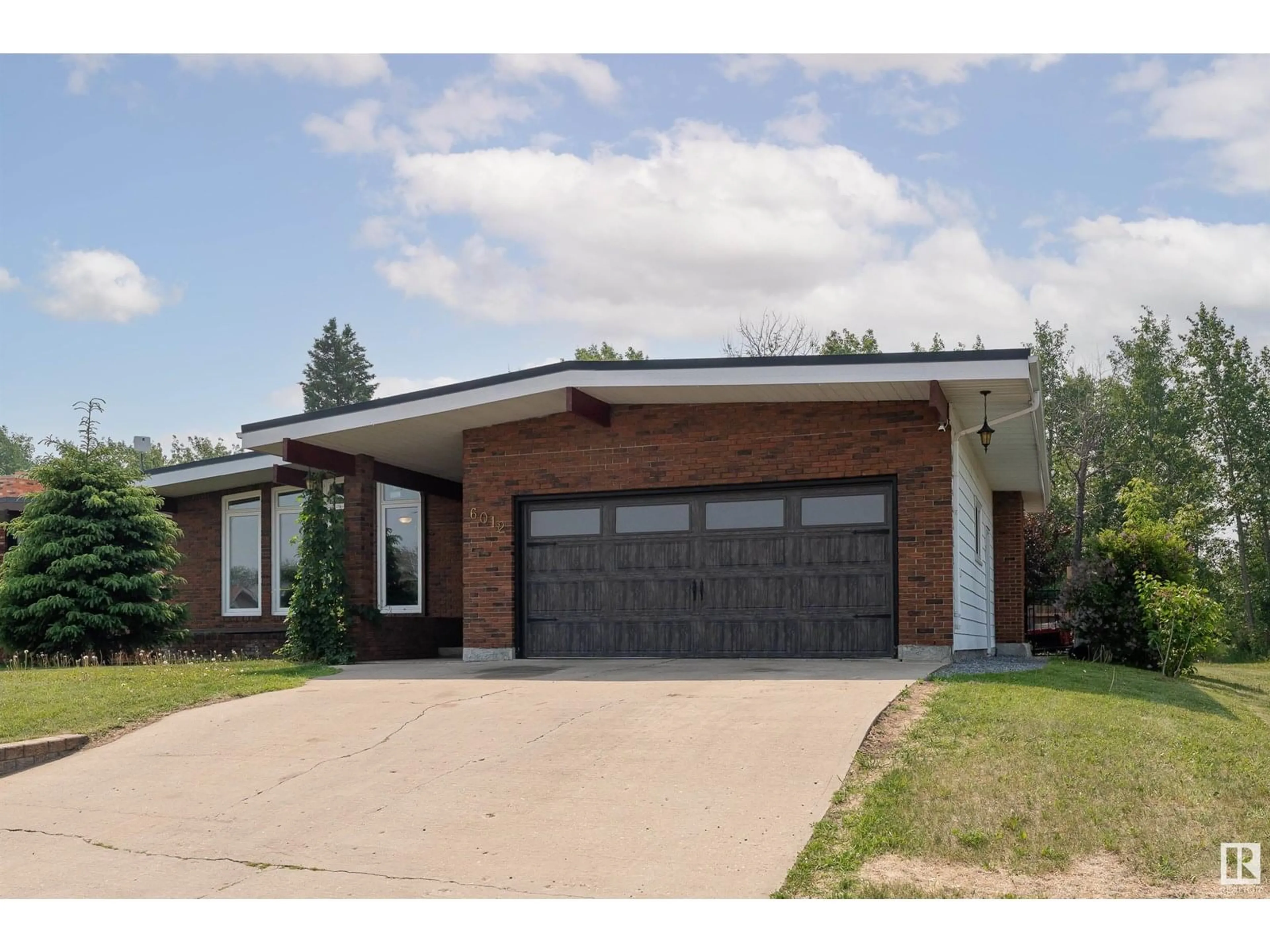 Home with brick exterior material, street for 6012 53 AV, Redwater Alberta T0A2W0