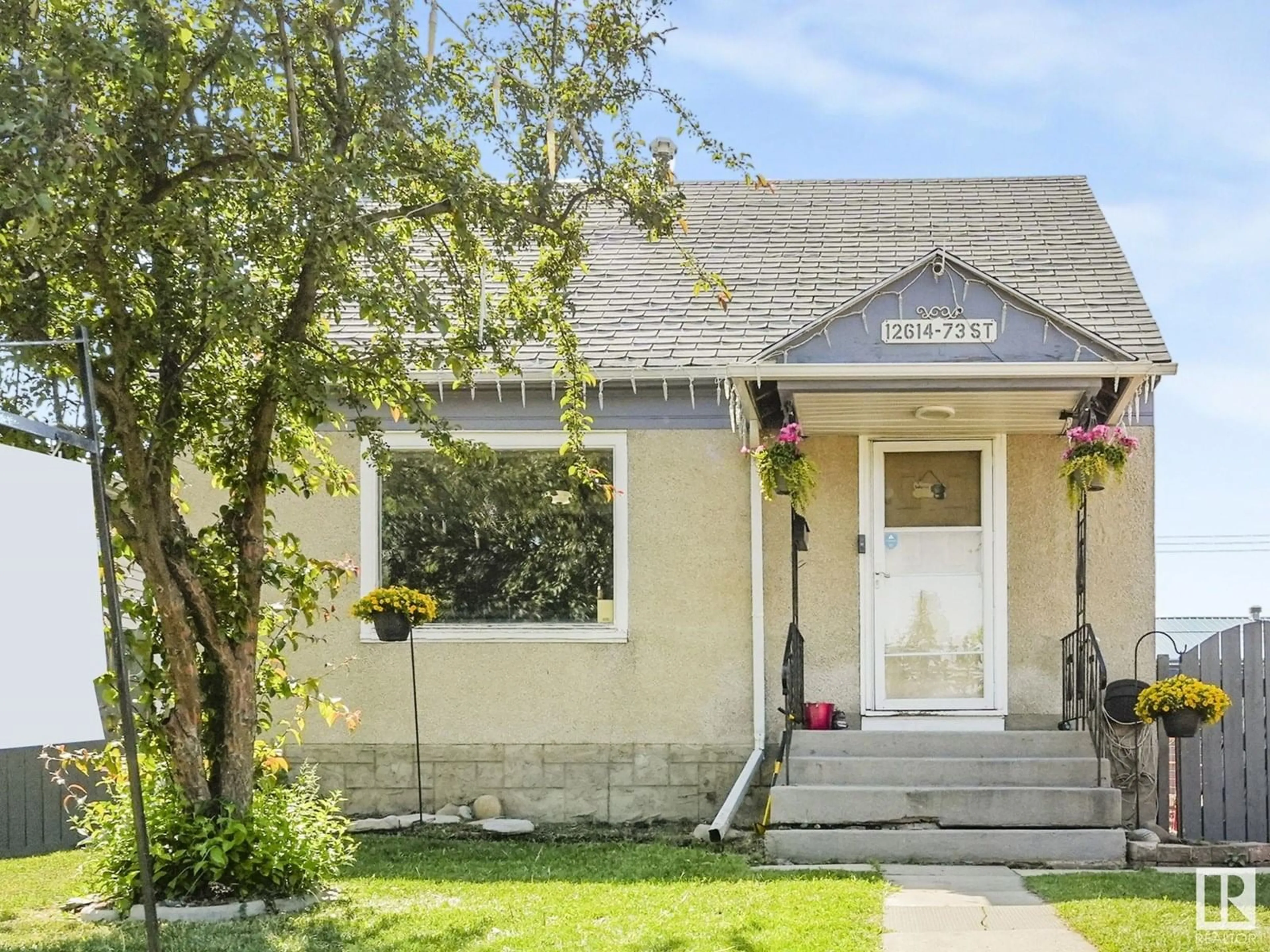 Home with vinyl exterior material, street for 12614 73 ST, Edmonton Alberta T5C0S8