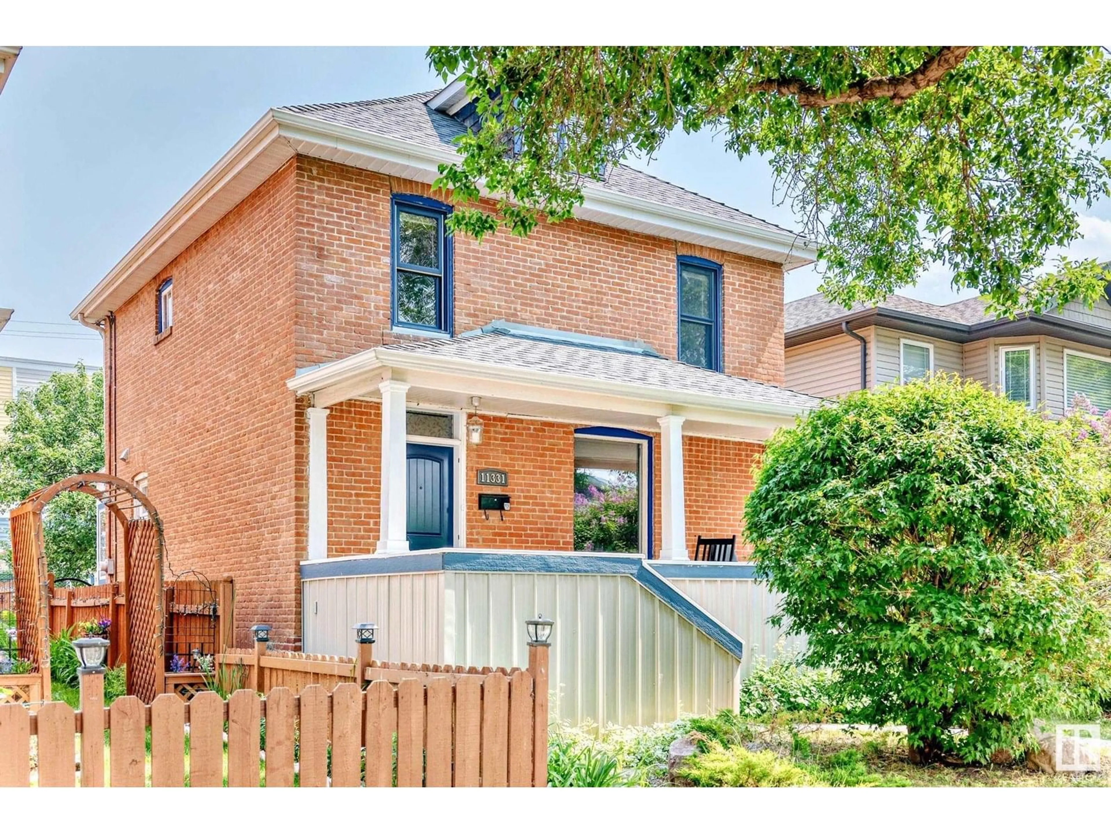 Home with brick exterior material, street for 11331 95A ST NW, Edmonton Alberta T5G1P2
